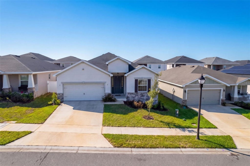 Photo of 1104 Mountain Flower Lane, Ln, Davenport, FL 33837 (MLS # O6447544)