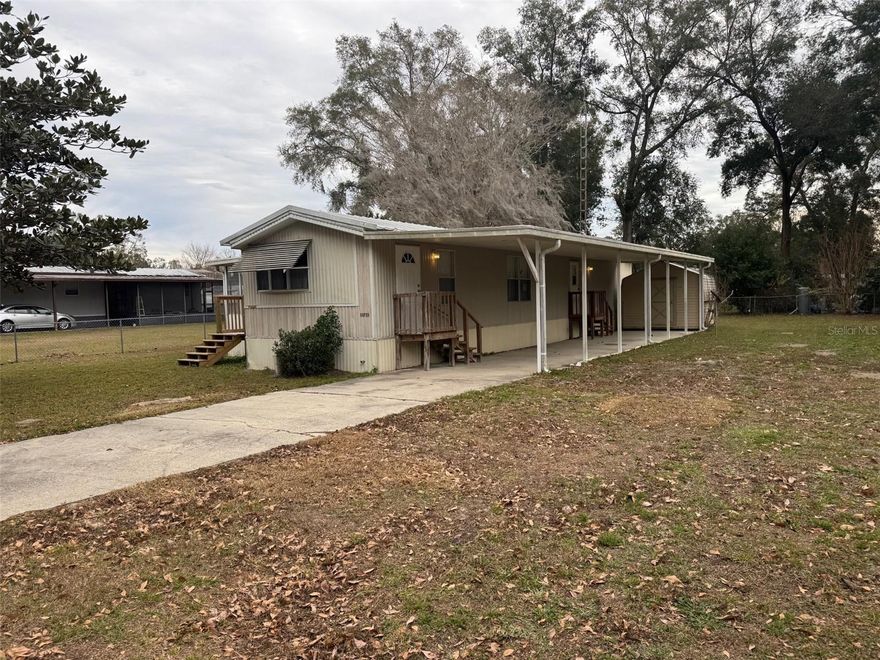 BACK ON THE MARKET!!  FINANCING FELL THROUGH!! Single wide manufactured home in very good condition.  This home was ordered originally with 3/4 inch plywood sub-flooring and it's very solid.  Two bedrooms, one bathroom and a very large living room that exits out to your 12' X 20' Florida Room with new floor joists, plywood sub-floor and new carpet.  There's also a 12' X 50' paved carport and a concrete driveway.  This home has a metal roof-over the original metal roof.  The foundation is a solid concrete slab with concrete piers and tie downs. This home was setup great when it was brand new in 1991.  This home would be a great starter home or solid rental property.