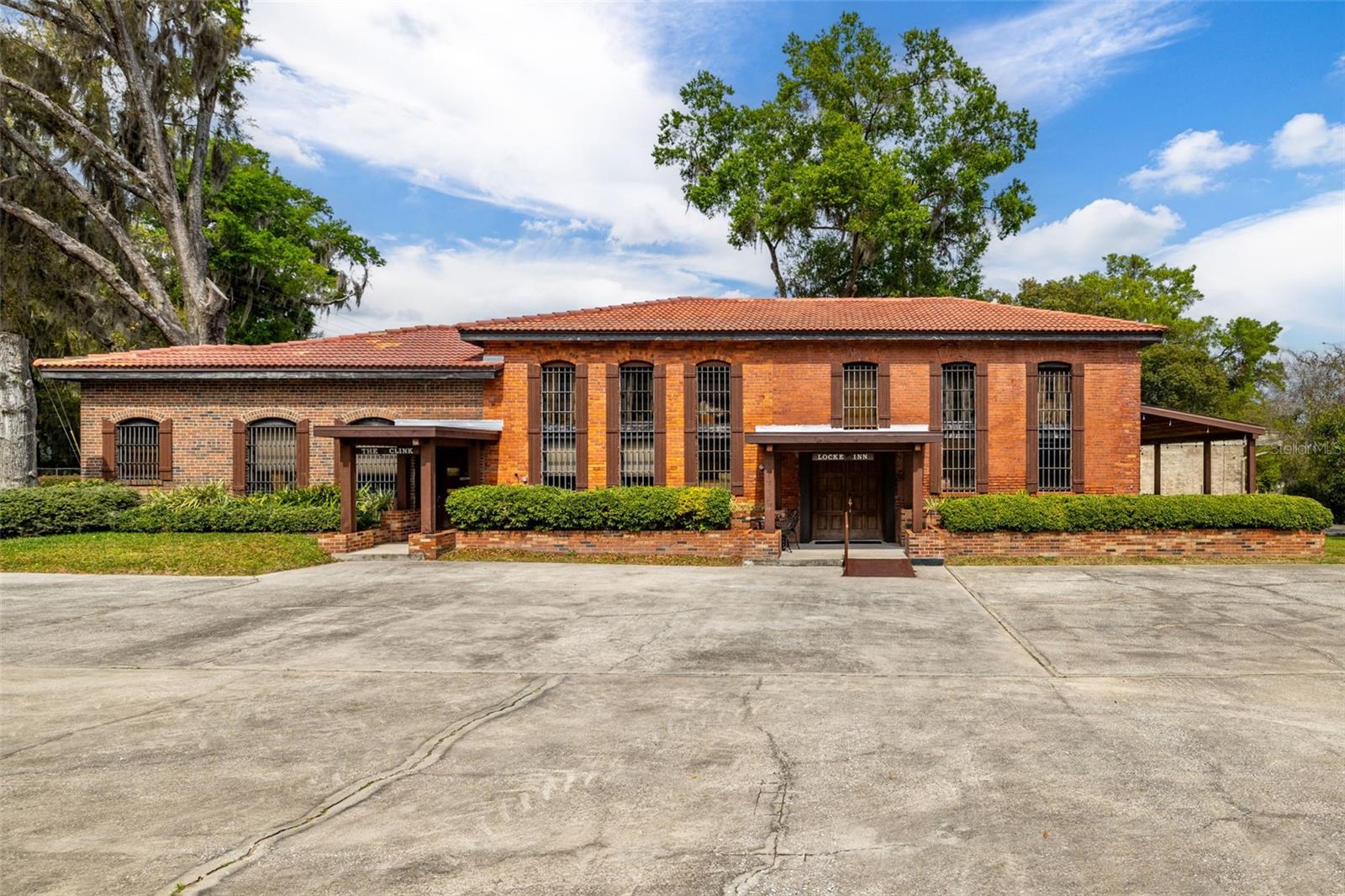 THE OLD PASCO COUNTY JAIL – A Truly Unique Home/Office Property in Dade City, Florida!
Nestled in the heart of Dade City, this historic gem, built in 1892, is the oldest brick building in Pasco County. Currently operating as "The Locke Inn Dade City," an Old Western-themed Airbnb, this one-of-a-kind property offers an incredible blend of history, charm, and modern amenities. Perfect for historic enthusiasts!
Renovated in 2023, the building boasts fully updated systems and features, ensuring comfort and convenience while maintaining its timeless character. With over 30 parking spaces, this versatile property is ideal for both personal and business use. It offers two separate addresses and entrances, making it easy to live on one side and work on the other. 2 Business addresses and entrances.
Whether you're seeking a rental or unique home, a stylish office, or a combination of both, the possibilities are endless with this extraordinary property. Don't miss your chance to own one of the coolest buildings on the market!
Act fast – owners will take the property off the market for the upcoming rental season