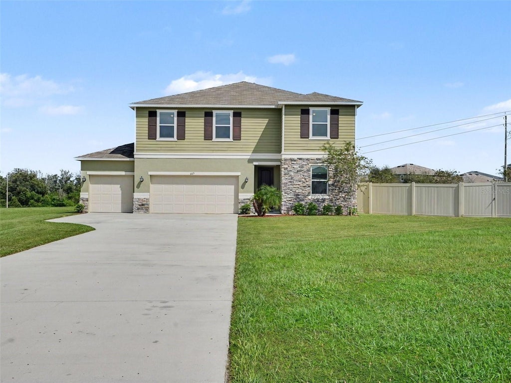Photo of 669 Sarner Pass Way, Winter Haven, FL 33881 (MLS # TB8556664)