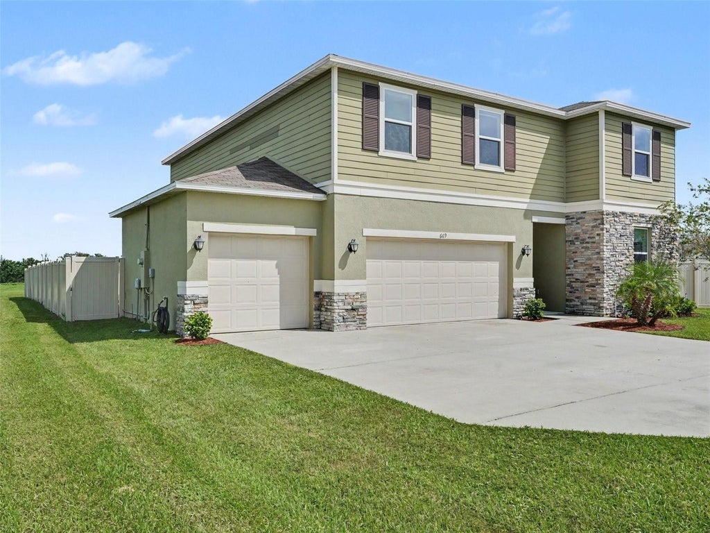 Photo of 669 Sarner Pass Way, Winter Haven, FL 33881 (MLS # TB8556664)