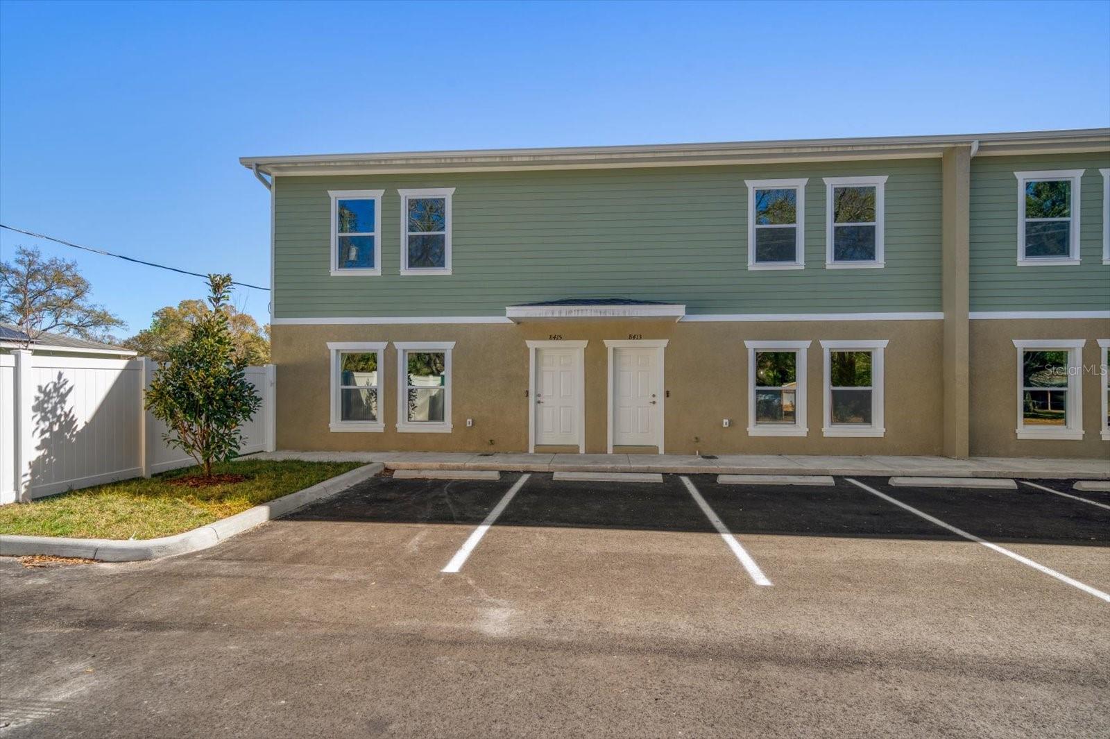 One or more photo(s) has been virtually staged. One or more photo(s) has been virtually staged. One or more photo(s) has been virtually staged. One or more photo(s) has been virtually staged. Excellent Location New Built Townhouses-End unit has 3 bedrooms, 2.5 bathrooms, according to Builder's Plans 1800 sq ft, with porcelain wood look tile floors downstairs, open floor concept, kitchen has an eating bar area, granite counters, stainless steel GE appliances, indoor laundry and off the kitchen a large rear porch that has storage area. Upstairs is the primary bedroom with an en-suite that has dual sinks, and a large walk-in shower. The primary suite has his/hers walk-in closets, all flooring upstairs is luxury wood look vinyl, hall bathroom to service 2nd and 3rd bedroom has a tub shower. These townhouses have a concrete block firewall from slab to roof for added safety and adds to quietness between units. Added features are LED recessed lighting, video front doorbell, 5-1/4 baseboards, wood stained stairs, designer plumbing fixtures, lighting and ceiling fans, half bath located under stairs, low E windows, programmable a/c thermostat, silent close cabinetry, kitchen cabinets are stacked for added eye appeal, exterior is concrete block stucco and upstairs Hardie siding for low maintenance. Bedroom Closet Type: Walk-in Closet (Primary Bedroom).