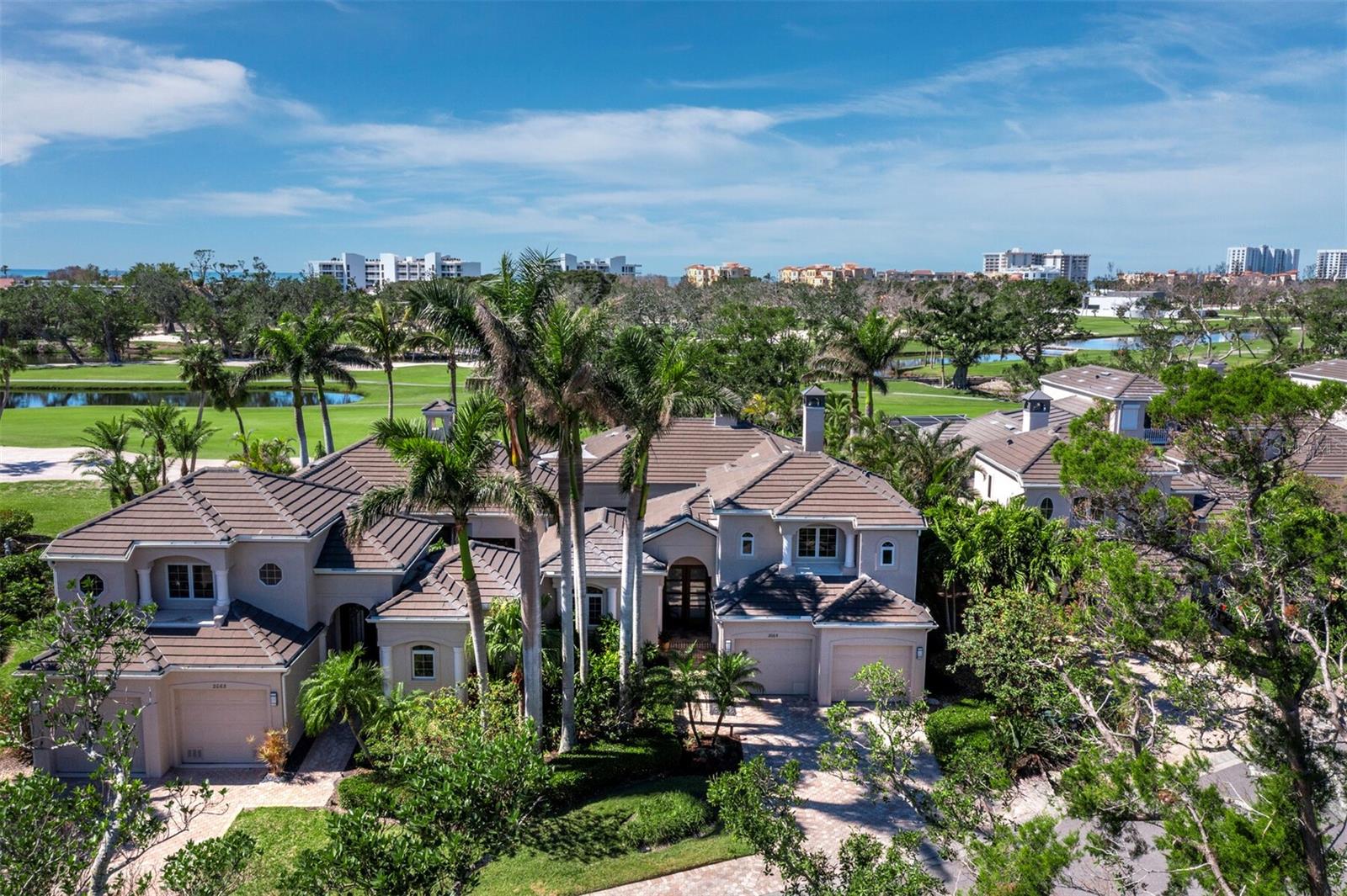 Welcome to 2065 Harbour Links Dr, a beautifully maintained 3-bedroom, 3.5-bathroom, 2,865 sq. ft. home in the exclusive gated Bay Isles community, within the highly sought-after Emerald Pointe North enclave—an intimate community of just six homes. Offering golf course views, a private pool, and a separate 1-bedroom casita with a full bathroom, this residence blends privacy, comfort, and convenience in a maintenance-free setting. Inside, the open-concept design features high ceilings, and large windows for natural light. The stunning chef’s kitchen is a true showpiece, featuring custom modern white cabinetry, a large center island, high-end appliances, granite countertops, and sleek finishes, creating a stylish yet functional space. The primary suite offers lanai access, a spacious en-suite bath, and a walk-in closet. The detached casita is perfect for guests, in-laws, or a private home office, offering its own bedroom, full bath, and separate entrance. At the center of the home, a beautifully transformed courtyard features a custom electric louver system with rain sensors, allowing for an additional 400 square feet of living space. Provides use for year-round enjoyment of this private indoor-outdoor space. The screened-in lanai and pool area provide a peaceful retreat with ample space for entertaining. Includes deeded access to the Bay Isles Beach Club, a private Gulf-front retreat with gated parking, shaded picnic areas, grills, restrooms, and showers—just minutes away. Additionally, optional membership to the Longboat Key Club offers access to championship golf, tennis, a marina, fine dining, and a luxury spa. Located near St. Armands Circle, dining, shopping, and waterfront activities, this home is a rare opportunity in Longboat Key.