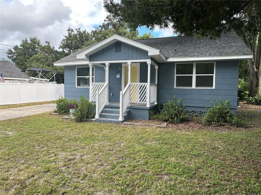 Welcome to Old Seminole Heights, once of the original historic neighborhoods in Tampa that continues to attract new residents of all ages and backgrounds. This home, with gracious sized rooms, maintains all of the character of its history while taking advantage of full modern upgrades for easy living.  Step through the front door and you will find a large and bright living room with original hardwood floors.  Just off to the side is a small private office complete with builtins. Two bedrooms and a renovated hall bath round out the original part of the home.  The large kitchen with wood cabinetry, granite counters and all new appliances opens onto the huge bright family room providing additional space to gather with loved ones.  The primary suite creates a split floorplan allowing privacy from the rest of the house. Its bathroom has a large walk in shower and two vanities as well as hookups for laundry. Beyond the family room is another sunny ante room that could be used as a mudroom, an additional office or a small sitting area overlooking the backyard. The driveway will hold several cars, either outside or under the carport. The large yard will provide plenty of space for flag football, large gatherings, or even the addition of a garage, a pool, an ADU or possibly even all three!  If you are looking for space, this is the home for you!