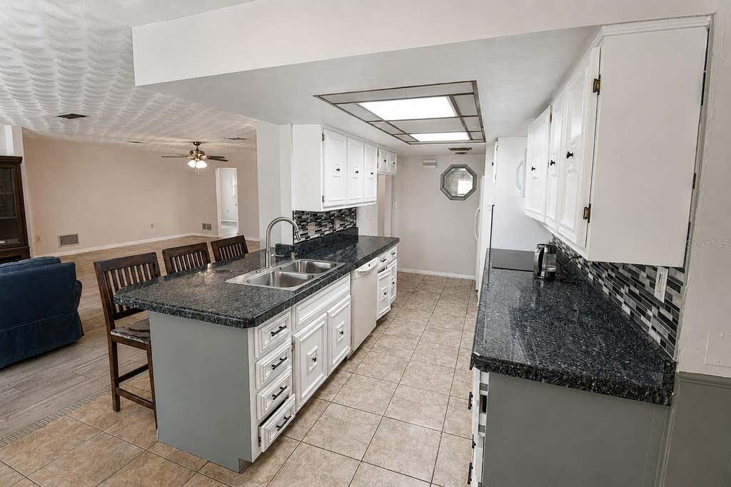 Photo of 22128 Bronxville Avenue, Port Charlotte, FL 33952 (MLS # C7528085)