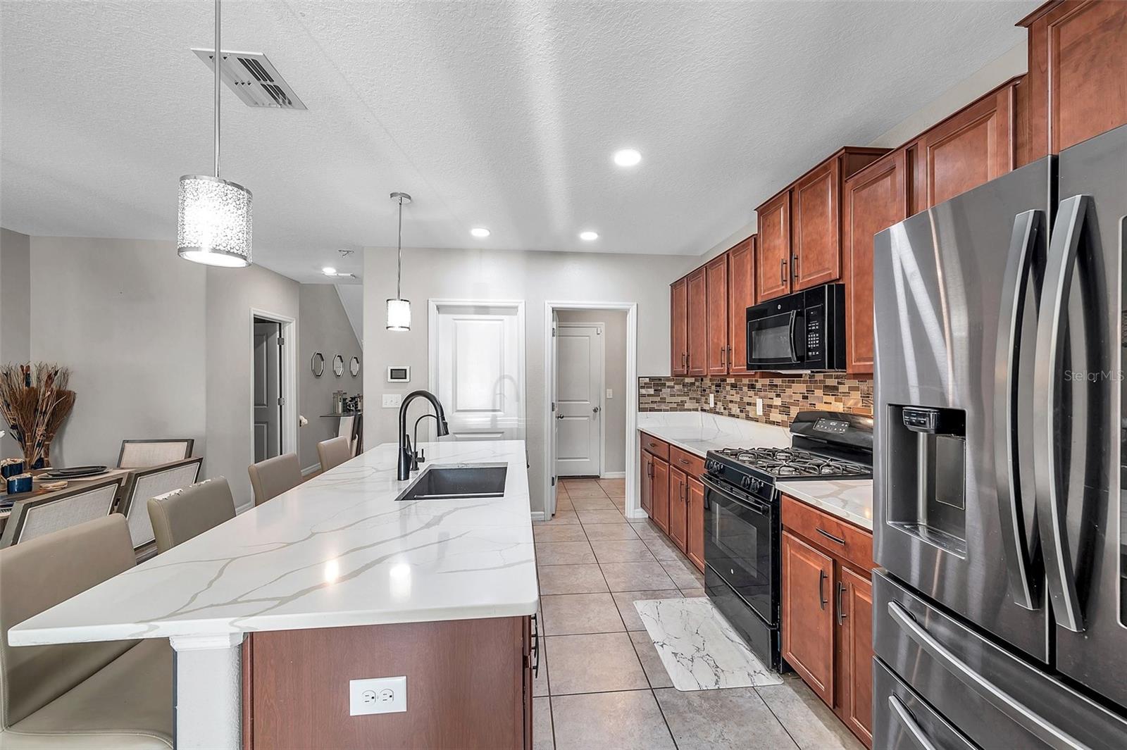 **PRICED TO SELL** Seller will contribute $20,000 for deep cleaning, painting and carpet replacement. Home needs a bit of TLC. Welcome to your dream home in the desirable Belmont community! This 5 bedroom, 2.5 bath, 2 car garage home offers spacious living and modern amenities. LOW HOA at JUST $10/MONTH! Built just 4 years ago, this home combines elegance with functionality.
As you step inside, you'll be greeted by a bright and airy floor plan featuring a master bedroom conveniently located downstairs, complete with large walk-in closets for ample storage. Upstairs, you'll find four additional bedrooms, two of which boast their own walk-in closets, providing plenty of room for family and guests.
The heart of the home is the kitchen, showcasing elegant quartz countertops, a stylish backsplash, gas stove and a pantry for all your storage needs. Whether you're preparing a gourmet meal or enjoying a casual breakfast, this kitchen is sure to impress.
Outside, the fully fenced backyard offers privacy and space for outdoor entertaining or relaxation. Plus, with a built-in water softener and a Ring doorbell included, convenience and security are at your fingertips.
The Belmont community itself offers an array of amenities for residents to enjoy, including walking trails, multiple playgrounds, a basketball court, and two pools; a gorgeous resort-style pool and a lap pool. Tennis enthusiasts will appreciate the two tennis courts available for a friendly match with neighbors.
Convenience is key with an elementary school located within the community, as well as easy access to shopping, dining, Sam’s Club, St. Joseph's hospital, VA annex outpatient facility, YMCA, and major highways for a stress-free commute to downtown Tampa, MacDill AFB, I-75, I-4, and beyond.
Don't miss out on the opportunity to call this beautiful Belmont home yours. Schedule your showing today and start living the Florida lifestyle you've always dreamed of!
