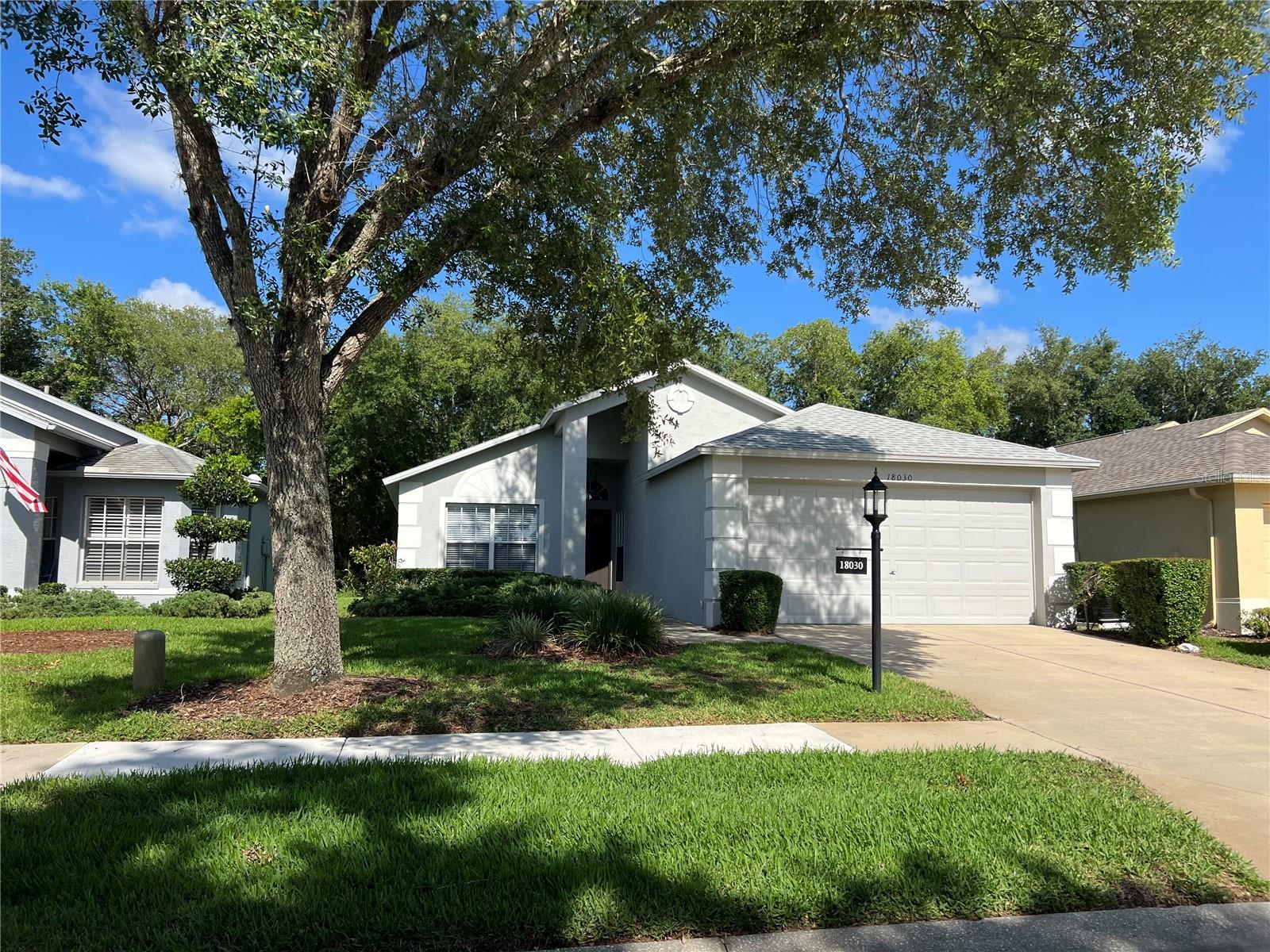 LONG TERM/ANNUAL, FULLY FURNISHED 2 BED PLUS DEN, 2 BATH, 2 CAR GARAGE HOME IS LOCATED IN THE ACTIVE, OVER 55 COMMUNITY OF HERITAGE PINES!! This IMMACULATE home is completely furnished, down to the linens and cookware. Over 1,300 sq ft of well designed living area. Large, open living and dining areas with the beautifully appointed breakfast bar and kitchen as the focal point. Light and bright, with sliding glass door opening onto the screened lanai with a wooded view! The kitchen has attractive wood cabinets, refrigerator w/icemaker, smooth surface range, built in microwave, dishes, cookware, small appliances, utensils and lots of extras. There is a quiet breakfast nook at one end and the more formal dining at the other. The master bedroom is inviting and has its own bath, of course, with large closet. The second bedroom and den, with a nice sleeper sofa, are on the other side of the house for privacy. There is an inside laundry room with washer and dryer that opens to the 2 car garage with auto door opener and lots of extras for your use. LAWN SERVICE AND SPECTRUM CABLE ARE INCLUDED IN RENT! All located in the GATED, over 55 community with a stunning clubhouse and restaurant, golf course and driving range, fitness center, pickleball/tennis courts, community pool and so much more! You can make lifetime friendships by joining in to the incredibly varied activities offered! This is more than a rental opportunity, it is a lifestyle! Call for your private showing today!