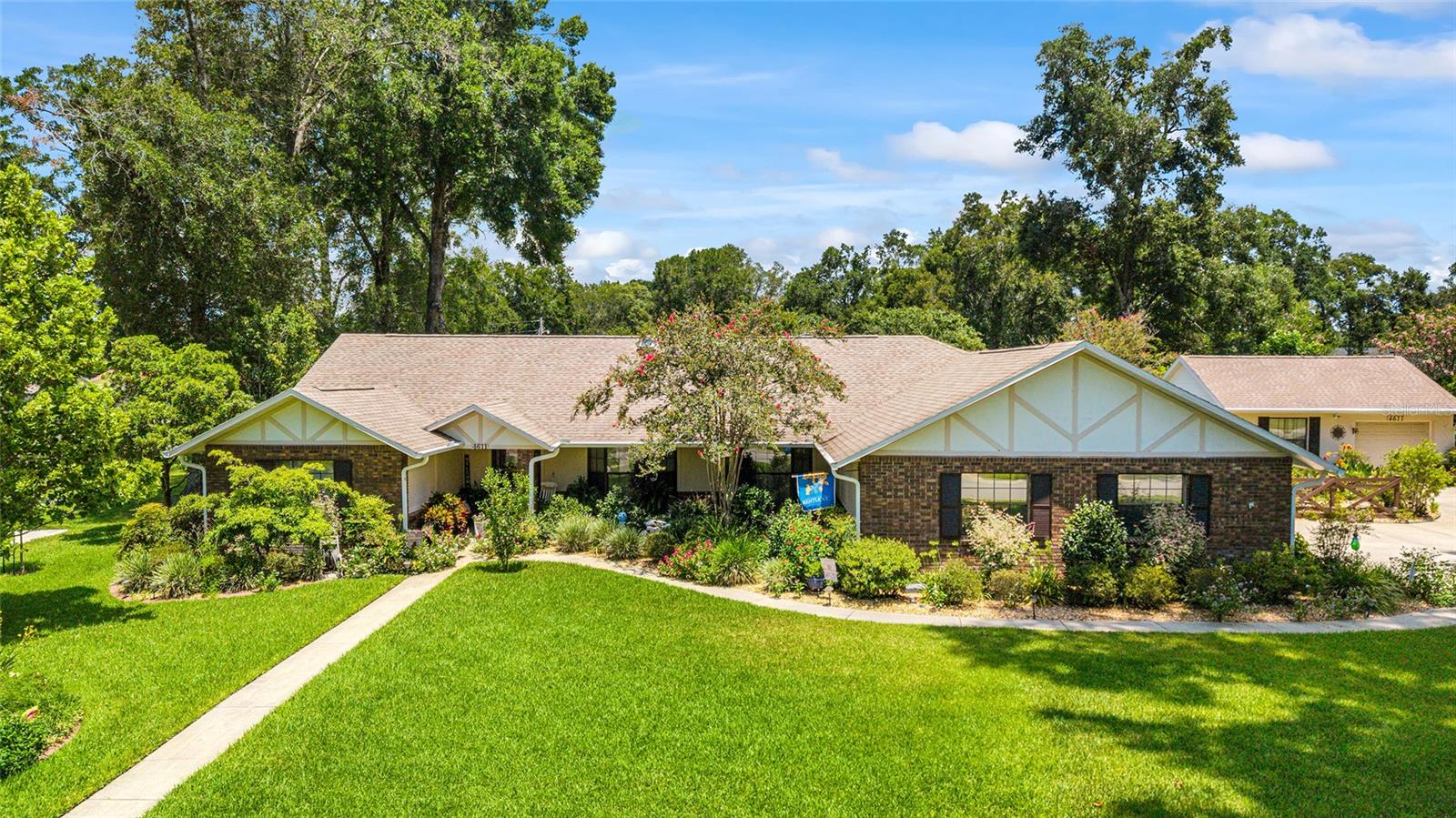 Welcome to this charming and meticulously upgraded ranch-style home, nestled on over half an acre—a rare find in SE Ocala with no HOA! This 3-bedroom, 2-bath residence with 2-car garage offers both comfort and function, perfect for everyday living and entertaining. ROOF 2020, AC (Main Home) 2025, Stove 2024, Request Feature sheet!
Step inside to find bay windows in both the living and formal dining rooms, letting in beautiful natural light. The vaulted ceilings in the family room, stone fireplace, and custom built-ins create a warm and welcoming gathering space. The thoughtfully updated kitchen boasts granite countertops, custom cabinet shelving used as a pantry, and a 2024 gas cooktop/electric bake stove for the culinary enthusiast.
Inside, the home showcases beautiful 3¼-inch hardwood floors (2023) throughout the master bedroom, family room, living room, and dining room, complemented by engineered hardwood flooring in the guest bedrooms for a cohesive, elevated look. Natural light flows effortlessly through three strategically placed solar tubes, creating a bright and airy ambiance. The epoxy-coated lanai floor adds both durability and style to your indoor-outdoor living experience. Function meets form in the remodeled laundry room (2024), complete with custom cabinetry, a deep sink, new countertops, and a convenient folding station. The master bath has been refreshed with a new shower floor (2024), while a generator transfer switch adds peace of mind during storms. Ample closet space throughout the home is complemented by an abundance of attic storage, including a rare walkable attic for all your seasonal or long-term storage needs.
Enjoy the backyard with plenty of space to add a pool, or simply relax under the pergola with pavers, outdoor grill area, and included hot tub. The property features mature fruit trees including grapefruit, avocado, lemon, lime, and more—perfect for the gardening enthusiast.
This property also offers a variety of bonus spaces and thoughtful extras that add tremendous value. A detached 24x24 garage/workshop, equipped with a 2024 AC window unit, provides the perfect space for crafts, hobbies, or even the potential for a guest cottage conversion. The garage roof was updated in 2018, and an awning was added to the side entry for additional protection and convenience. A tool shed (2022) offers extra storage for outdoor equipment, while decorative shutters enhance the workshop’s charm. For added functionality, the property includes an RV hookup and a dedicated irrigation well, allowing for a beautifully maintained lawn with significantly lower water bills. Centrally located near shopping, restaurants, and medical facilities, and just minutes from Downtown Ocala.
