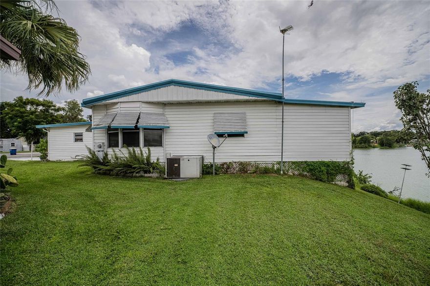 Welcome to waterfront living!!  This inviting 2 bedroom, 2 bathroom double-wide home with a bonus room and a bright Florida room, can be found perfectly situated in the highly sought-after Floral Lakes, a 55+ lakefront community. Inside, you’ll find a convenient kitchen passthrough to the dining area with a built-in dry bar, plus a comfortable split of living spaces ideal for relaxing or entertaining.

Major updates include a 2-year-old HVAC system, a durable metal roof with plenty of life left, and replaced flooring and subfloors—giving peace of mind for years to come.

Floral Lakes is known for its friendly atmosphere, very low HOA fees, no CDDs, and absolutely NO LOT RENT. Residents enjoy private boat ramp access to the lake for boating and fishing, a sparkling lakeside pool, shuffleboard courts, a clubhouse, and a park. Golf carts are welcome, and the calendar is always full of activities designed to keep you active, social, and entertained.

Don’t miss the chance to enjoy lakeside living in a vibrant community where every day feels like vacation!