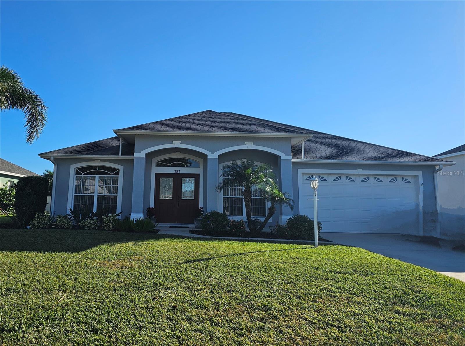 Located in the gated community of Ruby Lake, this stunning 3-bedroom, 2-bath Cassidy Ox floor plan offers a perfect blend of style and functionality. The home features a spacious layout with a formal living room, formal dining room, and a large family room, all designed for comfortable living. The updated kitchen serves as the heart of the home, boasting quartz countertops, a breakfast bar, a closet pantry, and tile flooring. The master suite is a private retreat, featuring a generous 17x15 bedroom, a walk-in closet, and a luxurious en suite bathroom with a soaking tub, walk-in shower, dual sinks, and tile floors. The secondary bedroom and bathroom are handicap accessible, thoughtfully designed with widened doorways for wheelchair access. Additional conveniences include an inside laundry room with a sink and a 10x38 screened lanai, ideal for entertaining. Practical features such as a two-car garage with a high-profile door, surround sound throughout, plantation shelves with ambient lighting, ceiling fans, and an irrigation system with a separate meter enhance the home’s appeal. Perfectly located near shopping, schools, medical facilities, and Legoland, this home also offers easy access to both Tampa and Orlando. A must-see property that combines comfort, convenience, and modern upgrades.