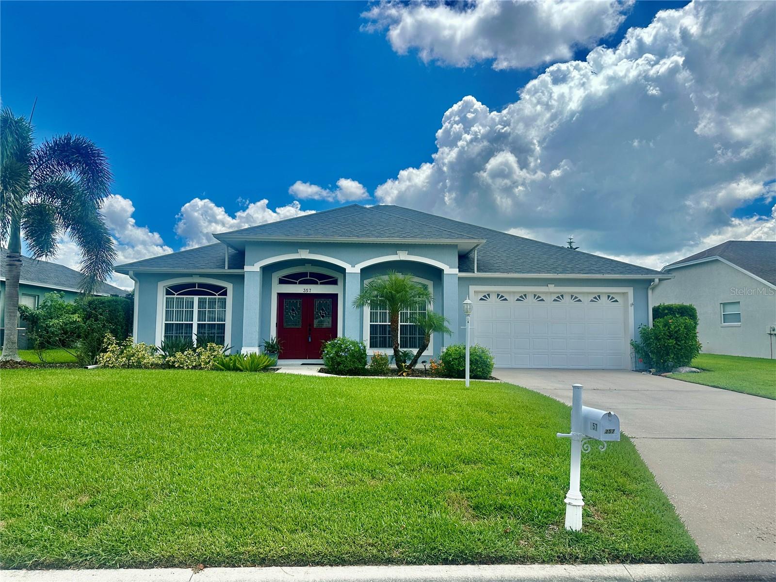 Located in the gated community of Ruby Lake, this stunning 3-bedroom, 2-bath Cassidy Ox floor plan offers a perfect blend of style and functionality. The home features a spacious layout with a formal living room, formal dining room, and a large family room, all designed for comfortable living. The updated kitchen serves as the heart of the home, boasting quartz countertops, a breakfast bar, a closet pantry, and tile flooring. The master suite is a private retreat, featuring a generous 17x15 bedroom, a walk-in closet, and a luxurious en suite bathroom with a soaking tub, walk-in shower, dual sinks, and tile floors. The secondary bedroom and bathroom are handicap accessible, thoughtfully designed with widened doorways for wheelchair access. Additional conveniences include an inside laundry room with a sink and a 10x38 screened lanai, ideal for entertaining. Practical features such as a two-car garage with a high-profile door, surround sound throughout, plantation shelves with ambient lighting, ceiling fans, and an irrigation system with a separate meter enhance the home’s appeal. Perfectly located near shopping, schools, medical facilities, and Legoland, this home also offers easy access to both Tampa and Orlando. A must-see property that combines comfort, convenience, and modern upgrades.