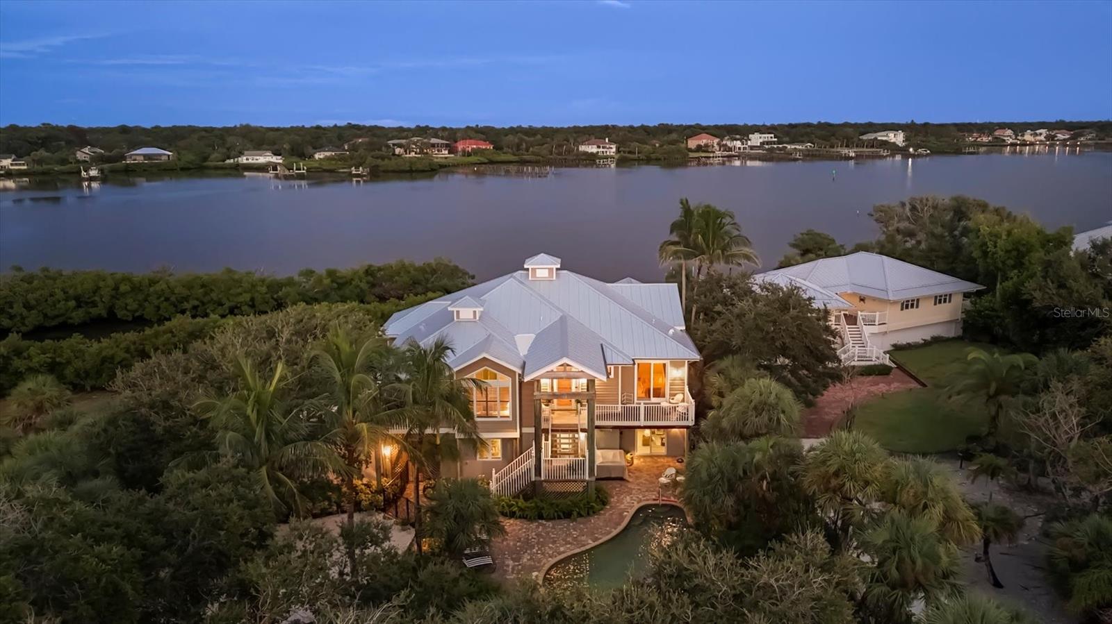 LUXURY WATERFRONT HOME WITH EXCEPTIONAL FEATURES AND PRIME LOCATION
Experience the epitome of Florida Waterfront living in this meticulously maintained, better-than-new three bedroom, three bath home and three car garage. Nestled along the serene Intercoastal waterway, this stunning residence offers a perfect blend of elegance, comfort, and outdoor leisure. Streaming with natural light, the open floor plan features soaring vaulted ceilings crafted from warm cypress wood, and stylish tile flooring, Generator
Impact Hurricane windows & sliding doors add peace of mind and ultimate comfort,
Recent Upgrades include: New Metal Roof, Septic System, Hot Tub, landscaping, Pool heater and motor, New elevator cab, motor & hydraulic system & controls.
Relax in the heated saltwater pool, surrounded by beautifully landscaped gardens. Enjoy direct access to your private boat dock, Ideal for boating, fishing, and water adventures. This home boasts two inviting porches, one perfectly positioned for sipping your morning coffee while the sun rises, and the other offering breath taking sunsets. Two deeded beach easements provide exclusive access to pristine shoreline, offerings the ultimate coastal lifestyle. A spacious, air-conditioned flex area for hobbies or workshop. This property stands out as a pristine move-in-ready home, with Whole Home Generator. Don't miss this opportunity. County Records has property listed as 2 bedroom, 3 bathroom home.