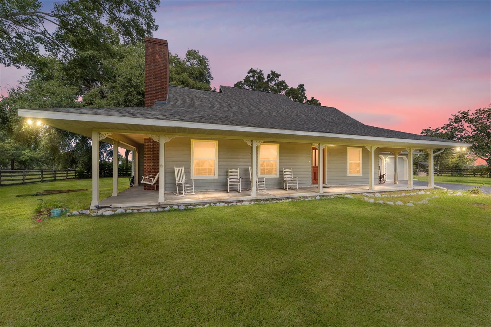 Fantastic location in sought-after SW Ocala! This charming FARMHOUSE sits on just under 3 cross-board fenced acres and offers endless potential—ready for you to make it your own. With 4 bedrooms and 3 baths, including a primary suite conveniently located on the first floor, the home features multiple living spaces with a living room with fireplace, dining room, and family room that provide plenty of room for family and guests. A spacious 2-car garage plus a separate workshop/pole barn/office make this property as functional as it is inviting. Screen enclosed lanai. And yes—BRING YOUR HORSE! Whether you’re dreaming of a cozy retreat or envisioning a stylish modern update, this property provides the perfect canvas. Don’t miss the chance to bring your vision to life in one of Ocala’s most desirable areas! Roof update in 2022. NO HOA.