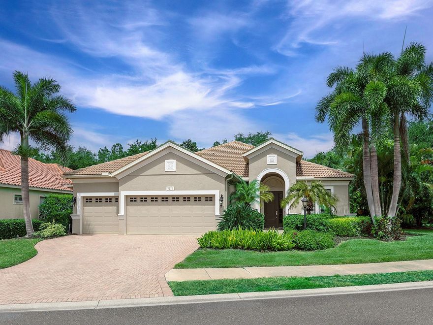 One or more photo(s) has been virtually staged. Welcome to 7210 Lake Forest Glen, where luxury, privacy, and beauty surround you in this exceptional maintenance-free home located in Lakewood Ranch Golf & Country Club. Perfectly situated on a private oversized cul-de-sac lot in Stone Ridge, this meticulously maintained Savona model by Neal, offers approximately 2,500 square feet with 3 bedrooms, 2.5 bathrooms, an office/den, and a 3-car garage.
This light-filled residence showcases 10-foot ceilings with elegant, coffered details, exceptional crown molding throughout, plantation shutters, and designer ceiling fans. Tile flooring runs throughout the home, including wood-look plank tile in the owner’s suite, office/den, and guest bedrooms.
A welcoming foyer opens to formal living and dining spaces, along with a private office/den featuring glass French doors—ideal for working from home or a quiet retreat. The open-concept floor plan is centered around a spacious family room with custom-built-ins and disappearing sliding glass doors that seamlessly blend indoor and outdoor living.
The beautifully appointed kitchen features cabinetry with glass-front upper doors, granite countertops, stainless steel appliances, a built-in desk area, breakfast bar, and casual dining space overlooking the family room.
The spacious owner’s retreat offers private lanai access, room for a sitting area, and a luxurious en-suite bath with dual vanities, soaking tub, walk-in shower, private water closet, and custom-designed walk-in closet with upgraded shelving and drawers.
Outdoor living is Exceptional with one of the largest lanai and lots in the neighborhood. The screened outdoor oasis features a resort-style pool and spa, lush tropical landscaping for added privacy, and a fully equipped outdoor kitchen complete with granite countertops, built-in refrigerator, gas grill, side burner, and sink. A generous covered entertaining area, cabana bath, outdoor shower, and gas fireplace complete this spectacular outdoor living space. You’ll love privacy as well as hosting guests and making wonderful memories in this outdoor oasis.
Living in Lakewood Ranch Golf & Country Club offers the opportunity to enjoy resort-style amenities with optional membership opportunities for golf, tennis, pickleball, fitness, dining, and social activities. Ideally located near world-class beaches, shopping, dining, and everything Lakewood Ranch has to offer.
A MUST SEE for buyers seeking a move-in ready home that blends luxury, privacy, and effortless Florida living.