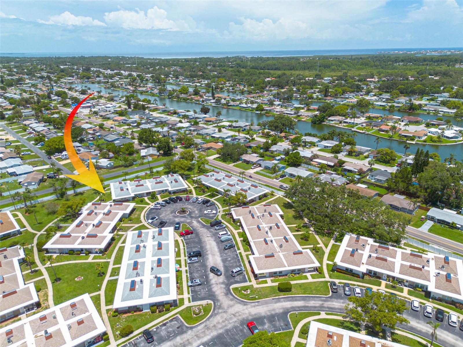 Enjoy the best of Florida living in this beautifully updated corner-unit condo located in the sought-after Tahitian Gardens, a gated, vibrant and active, 55+ community.
This light and inviting home features neutral tile flooring throughout, large windows that fill the space with natural light, crown molding, and an open layout that’s both functional and welcoming. The spacious living room flows seamlessly into the dining area and kitchen, where you’ll find ample cabinet storage, stylish dark granite countertops and matching backsplash, a coffee bar, and stainless steel appliances.
The bedroom and bathroom have been thoughtfully redesigned, converting two original bedrooms into one extra-large primary suite, and transforming two bathrooms into one that offers a tub/shower combo and dual sink vanity. The expansive bedroom is large enough for a king bed and additional furniture, and is complete with crown molding and a walk-in closet. Large windows provide a bright and airy feel.
Additional features include keyless entry, assigned parking just outside the front door, and a pavered front patio with sidewalk access that is perfect for enjoying morning coffee or greeting friendly neighbors.
Tahitian Gardens residents enjoy a resort-style lifestyle with a heated and cooled clubhouse, sparkling pool, shuffleboard courts, scenic lakeside walking paths, and a full calendar of social activities including bingo, cards, crafts, biking, and more!
Ideally located just minutes from the Gulf beaches, the famous Tarpon Springs Sponge Docks, shopping, dining, and public transportation.
Come see why so many call Tahitian Gardens home, this condo is move-in ready and waiting for you!
