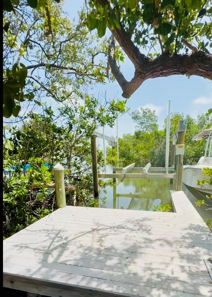 Brand new as of June 2025, this beautifully constructed boat dock is now available for purchase in the charming coastal enclave of Holmes Beach on Anna Maria Island. Thoughtfully designed for effortless access to Tampa Bay and the Gulf beyond, the dock comes fully equipped with electricity and water hookups, providing convenience and functionality for any boating lifestyle. The included 8,000-pound lift offers secure and reliable vessel storage in one of Florida’s most desirable waterfront settings.