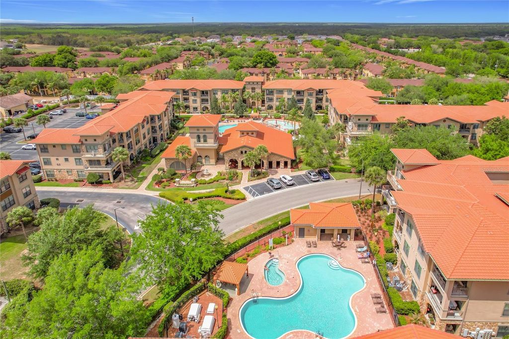 Photo of 910 Charo Parkway #311, Davenport, FL 33897 (MLS # O6394859)