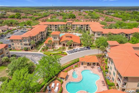 Photo of 910 Charo Parkway #311, Davenport, FL 33897 (MLS # O6394859)