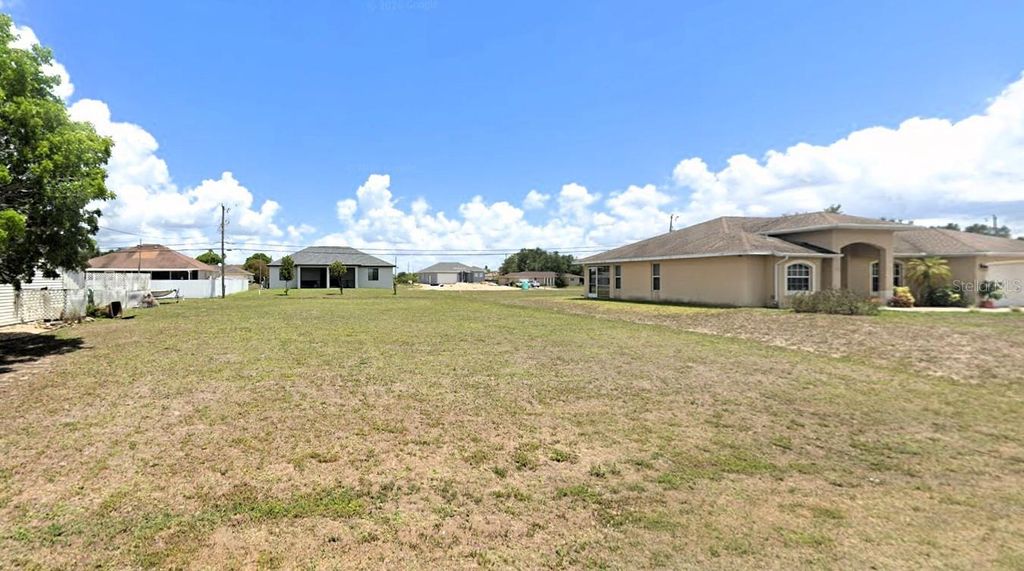 Photo of 1407 NE 12th Place, Cape Coral, FL 33909 (MLS # O6394618)