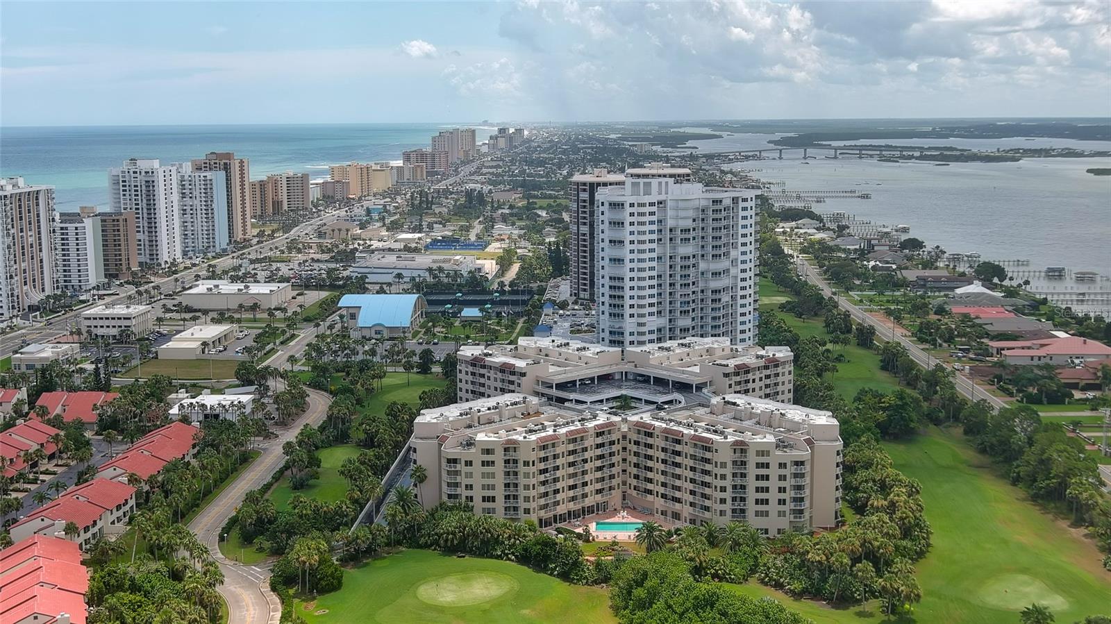 Coastal Living with Panoramic Views! Welcome to this stunning 3 bedroom, 3 bath condo offering spectacular views of the ocean, Intracoastal Waterway, and golf course...a rare trifecta of scenery! Located in a well maintained gated community, this fully furnished home captures the essence of coastal living with soothing ''colors of the sea'' decor and elegant luxury vinyl plank flooring throughout. Enjoy an open, light-filled layout perfect for relaxing or entertaining. Two master suites, each with a private balcony, perfect for taking in sunrise views or evening breezes. The third bedroom offers flexibility for guests or a home office. The location is unbeatable - walking distance to the golf course, the Shores Community Center with pickleball/tennis courts, Publix & Walgreens, a short walk to the beach. Whether you're active, social, or simply enjoy the ease of nearby conveniences, this condo delivers! Drive right up to your floor, no parking garage or elevator to deal with here! Guest parking on each level, too (golf carts ok!). Storage on ground floor. Community amenities include 2 pools (one indoor heated), hot tub, fitness room, library, dog park, and even a car wash! Welcome home!