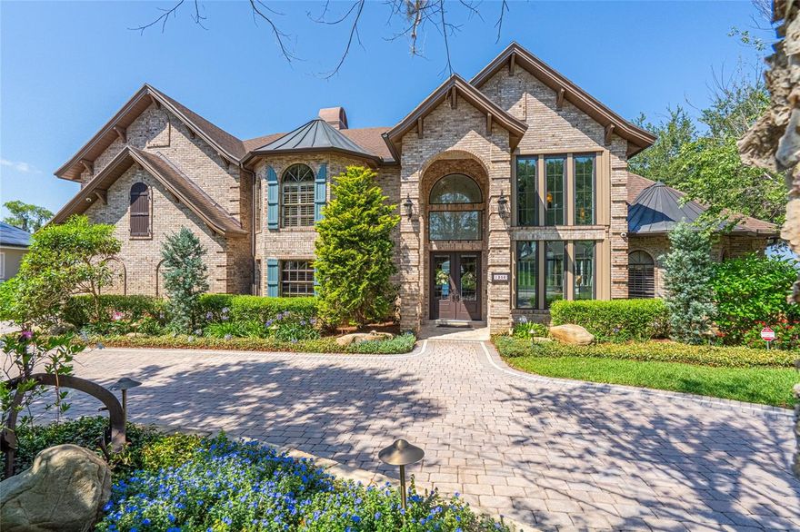 On the Point of Exclusive Margaree Gardens – Your Dream Home on Lake Minnehaha Awaits!
This stunning, completely renovated home sits directly on Lake Minnehaha, part of the Clermont Chain of Lakes, in the highly sought-after Margaree Gardens neighborhood. From the moment you step through the gorgeous double doors with leaded glass transoms, you'll be greeted by breathtaking lake views and an abundance of natural light, thanks to the two-story front windows.

The heart of the home is the kitchen, a chef's dream, featuring dual granite islands, Viking Professional grade appliances, including double oven's, built-in microwave drawer, farmhouse sink, and a stunning backsplash. The soft-close cabinetry and drawers add a touch of luxury. Plus, there's a Butler's pantry with additional double ovens, another farmhouse sink, and a second dishwasher for convenience.

The spacious living room, with a cozy gas fireplace, offers a perfect space to relax while enjoying the lake view. The kitchen and dining rooms flow seamlessly, allowing you to stay connected with your guests while enjoying the view. The sunken family room, also with lake views and a gas fireplace, leads into the bonus room that features a wet bar, pool access, with a sitting area, and an additional bathroom.

The master suite is truly a retreat, with incredible views of the lake, and his & her walk-in closets.  The master bathroom is a spa-like experience with dual vanities, an electric fireplace, a soaking garden tub, a massive walk-in shower with sauna, and even a dedicated coffee station room.

Step outside to the backyard oasis, where you'll find a boat dock with a screened room, boat lift, and seawall. The pavered pool deck is complemented by screened rear balconies and a porch for enjoying the outdoors in comfort. A fully equipped summer kitchen and a beautiful fireplace with double waterfalls create the perfect setting for relaxing or entertaining in your private outdoor paradise.

This home also offers His & Her offices, providing a dedicated space for work or study while still enjoying the tranquility of lake living.

Recent updates include:

Complete roof replacement, PVC plumbing, upstairs windows, crown molding, and trim.(2018)

Three new AC units with dehumidifiers (2020) and a service contract in place

Outdoor Summer Kitchen (2022)

Outdoor Fireplace and Fountain with double waterfalls (2022)

Whole house security system with 14 cameras (2022)

New landscape, irrigation system, and exterior lighting (2022)

Electric pool heater (2024)

Leaf filter gutter system on the rear portion of the home

Don’t miss the chance to own this incredible home! Schedule your showing today!