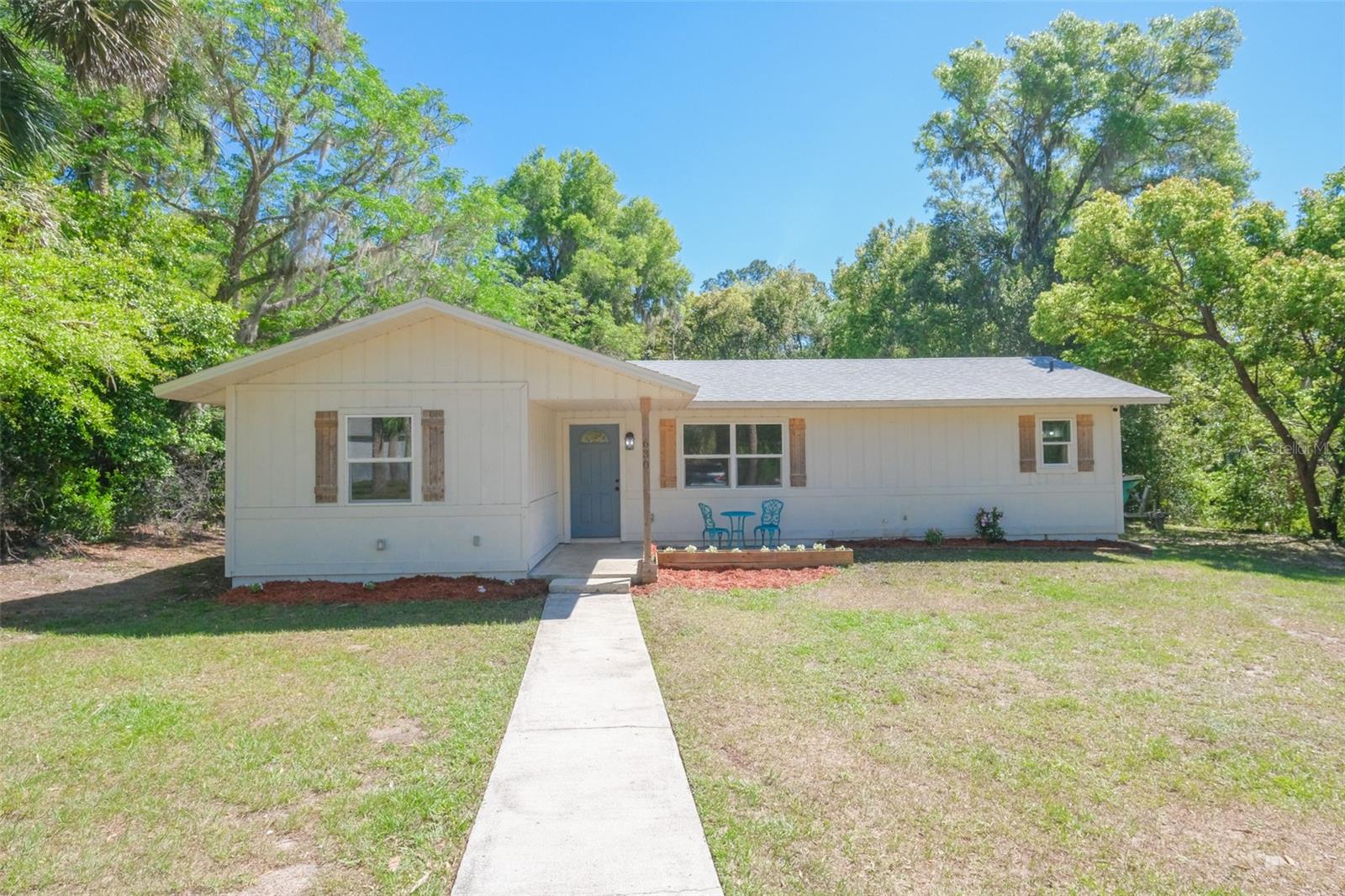 This Home Qualifies for the 100% Financing (No Money Down) Buyers Advantage Program!!! Welcome to your Orange City oasis! This 3 bed, 3 bath home offers 2307 square feet of comfort and convenience. You'll love the two bonus rooms - perfect for a man cave or hobby room. The outdoor patio is ideal for entertaining guests with its newer wood deck. Inside, you'll find updated cabinets with quartz countertops and tile backsplash. Plus, enjoy peace of mind knowing that all major systems have been recently updated: roof, septic, two A/C units, two water heaters plus a water softener and windows & sliding door too! With 0.57 acre lot you have plenty of room to park a boat or camper. Close to I-4 and major shopping centers nearby - this dream home won't last long!