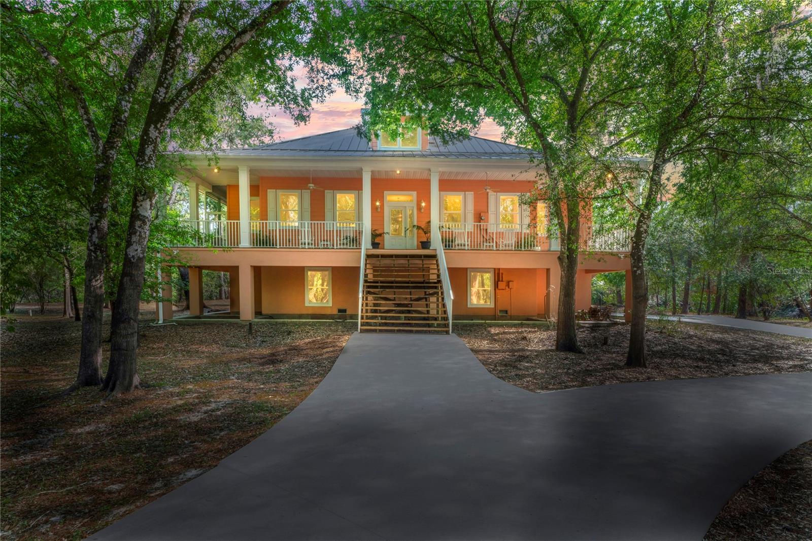 Tucked away at the end of a quiet cul-de-sac on the eastern edge of Hernando County, this extraordinary waterfront retreat offers rare peace, privacy, and direct access to nature. Now offered at a new price, the seller is highly motivated. So don’t miss this opportunity! Set on 1.5 acres with an incredible 780 feet of frontage along the Withlacoochee River, the property blends luxury, sustainability, and function in one impressive package. This custom-built home was constructed using Insulated Concrete Forms (ICF) and is LEED Certified, ensuring exceptional energy efficiency and long-term durability. Designed for both comfort and eco-conscious living, the interior features high ceilings, expansive living spaces, and serene river views from multiple rooms. Car enthusiasts will appreciate the oversized garage with space for up to eight vehicles! Outdoors, enjoy morning coffee on the screened wraparound porch, or launch a kayak right from your backyard. Located in the Riverdale community with no HOA fees or deed restrictions, this secluded haven is positioned conveniently between Dade City and Ridge Manor, with easy access to I-75 for a smooth commute. Whether you're seeking a primary residence or a weekend escape, this riverside home is a unique opportunity to embrace Florida living in its most tranquil form.