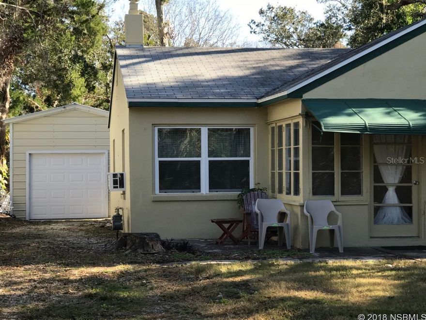 Beautiful tree lined street in the heart of New Smyrna Beach, just a short walk to Canal Street and only a few miles from the beach. Perfect size retirement or starter home. 2 bedrooms 1 bath, Florida room, mud room, screened porchnew appliances, new detached garage with remote.  Tenant occupied 24 hour notice required for viewing.Measurements approx and should be verified ;Water: City