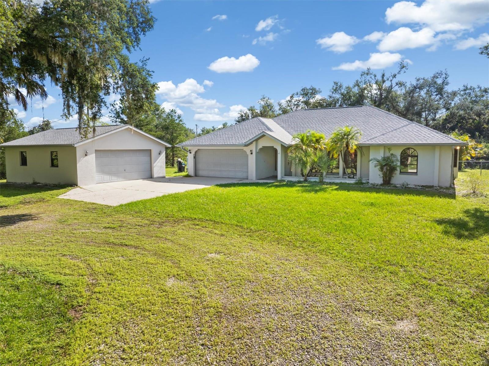 Old Florida Charm on 3.05 Acres – Updated Home with Pond, Additional Detached Garage/Workshop & More – North Port, FL
Step into the peaceful charm of Old Florida living with this beautifully updated home nestled on 3.05 acres of agricultural-zoned land in North Port/Sarasota County. Surrounded by nature and privacy, this property offers the ideal blend of rustic charm and modern convenience.
Inside, you'll find 3 Bedrooms, 2 Full Bathrooms, 1983 Square Feet of living area, a fully updated kitchen with tasteful finishes and all new appliances, perfect for home-cooked meals and entertaining. The home features brand new luxury vinyl plank flooring, a new A/C system 2025, new roof 2025, freshly painted interior, new ceiling fans, new light fixtures, and new hot water tank 2025— all the major upgrades have been done for you!
Another great features is the expansive screened-in lanai, ideal for enjoying Florida’s natural beauty in comfort — whether sipping your morning coffee, relaxing in the evening breeze, or entertaining friends and family.
The property also includes an additional large detached garage, offering ample space for a workshop, storage, or your recreational toys. A peaceful pond adds to the scenic charm and offers a perfect touch of tranquility.
With agricultural zoning, there’s room to create your dream lifestyle — bring your animals, plant a garden, or simply enjoy wide-open space with NO HOA restrictions and NO FLOOD INSURANCE REQUIRED! Click on the 3-D interactive video to immerse yourself in this beautiful home!