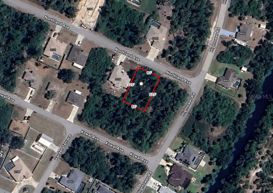 Conveniently located building lot in the growing City of North Port. Seven minutes to I-75. A Publix Shopping Plaza and all it's shops and restaurants is also less than five minutes drive. The Port Charlotte Mall is also less than a five minute drive. Highly rated Sarasota County Public Schools. Not in a flood zone. There are nice houses all around.