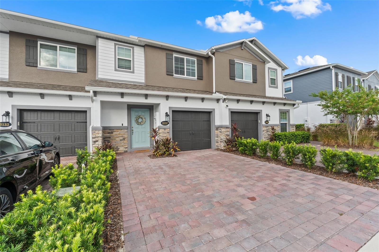 Welcome to this stunning 3-bedroom, 2.5-bathroom townhome built in 2023, offering 1,569 sqft of modern design and comfort in a prime location. Step inside to find beautiful wood-look tile throughout the first floor and cozy carpet in the upstairs bedrooms and loft. The open-concept kitchen and living area is perfect for entertaining, featuring sleek quartz countertops and stainless steel appliances.Enjoy your own private back patio with no rear neighbors. The one-car garage includes upgraded epoxy flooring, and the paver driveway adds a touch of elegance.Located in a gated community with a dog park, this home offers both security and amenities. You're just 5 minutes from SR-417, 10 minutes to UCF, and 20 minutes to Orlando Executive Airport—making this an unbeatable location for commuters, students, or professionals.Don’t miss your chance to own this beautiful, move-in-ready home!