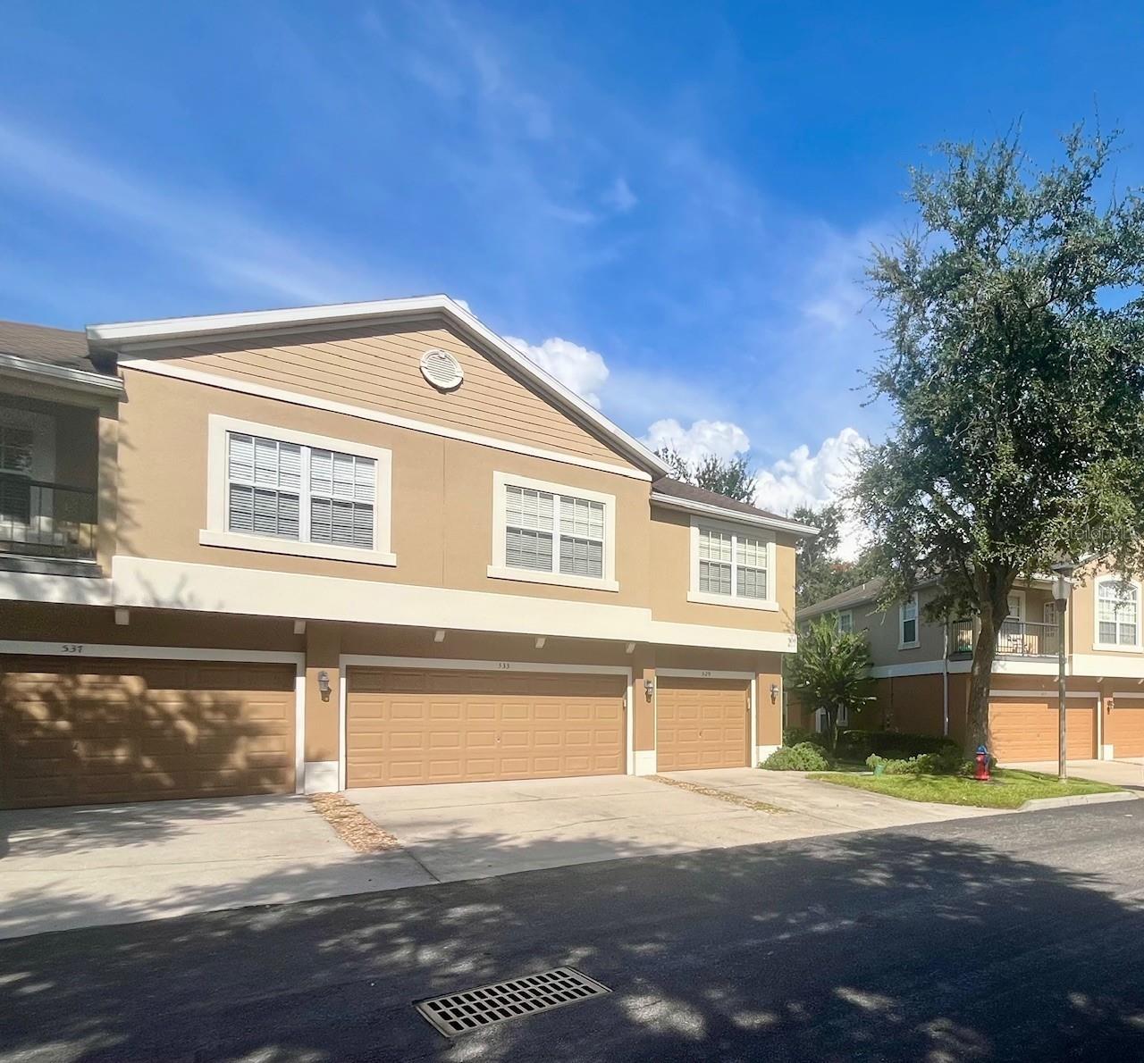 Welcome to your Sanctuary nestled with in the serene Overlook at Parkside Gated Community in Apopka. This charning 3 bedroom 2 1/2 bath unit is a true gem that combines modern elegance with the warmth of home. As you step inside to a bright,open floor plan with stylish laminate flooring through out the main area.The spacious kitchen, featuring stunning 42 inch cabinets that provide ample storage as well as large pantry equipped with stainless steel appliances. The breakfast bar is a great space for entertaining guest. The spacious living room and dining room have lots of windows. Step outside the two sliding glass doors to a charming backyard with no behind neighbors and enjoy the cover patio and perfect spot for relaxing or entertaining. Upstairs, the primary suite offers beautiful modern en suite with dual sinks and a walk in shower. The upstairs has new waterproof luxury vinyl tile through-out. Enjoy the convenience of a two car garage with private driveway also guest parking close by. This property is surrounded by mature tree and meticulous maintained landscaping. Located just moment away from shopping center, restaurants, and major highways like SR429 and SR441, this property ensures you are connected to everything you need.Don't miss out on this opportunity to own a piece of paradise in Apopka!Schedule you private tour today.