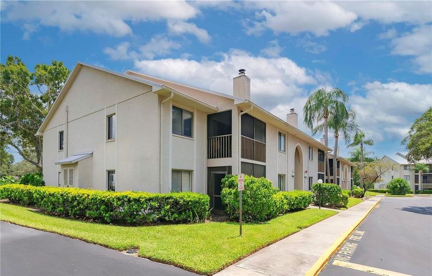 Big price reduction, clean and very nice, you will love this bright and immaculate home! Located in famous Dunedin, just minutes from Downtown, this beautiful 2 bedroom, 2 full bath condo has wood laminate flooring, gorgeous plantation shutters on the windows, and sliding door to the the screened in balcony that over looks the heated pool right across the street. Enjoy dining in the spacious dinette area, or sit at the breakfast bar. The kitchen has solid surface counters, updated appliances and a pantry. The wood paneled ceiling and crown molding sets this home apart from the others, and with a low association fee, this makes a great vacation home, or full time residence for those who enjoy opulence!