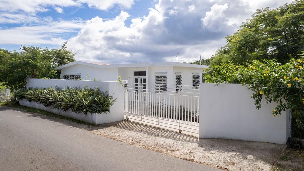 Casa del Sol is a wonderful well maintained home on idyllic Vieques Island, Puerto Rico. This spacious, airy house blends island charm with modern functionality, making it the perfect retreat or permanent home.
There is one bedroom and one bathroom designed with comfort and relaxation in mind with all rooms being oversized.
The home features expansive indoor and outdoor living areas, perfect for entertaining or simply quiet enjoyment. There is a large, covered outdoors space off the kitchen with ample room for sitting areas and outdoor dining and will surely become the heart of the home.
The lower portion of the home has roughed-in electric and plumbing offering exciting possibilities for customization - a second bedroom and bathroom or studio apartment. This would be ideal for extra income or private space for your guests. The space is ready to be tailored to your vision. Additionally, there is a full two car garage with space for tools and a large workshop/art studio.
Casa del Sol's yard is very lush with a variety of plantings, creating a serene and private environment. There is ample space for a swimming pool if desired. Some of the plantings include, succulents, coconut palms, avocado, passion fruit, creole lemon, cactus, aloe and a wide variety of tropical flowers.
There are wonderful ocean views from the roof of the home and would be perfect for a roof top terrace. There is water and power extended to the roof allowing the creation of an outdoor kitchen/living space.
Casa del Sol is a wonderful home offering an opportunity to craft a lifestyle, combining the beauty of Vieques with the comfort of a home designed for you. Whether looking for a new home, creating a vacation getaway, or to invest in a property with great potential, this is your chance to make your dream a reality.