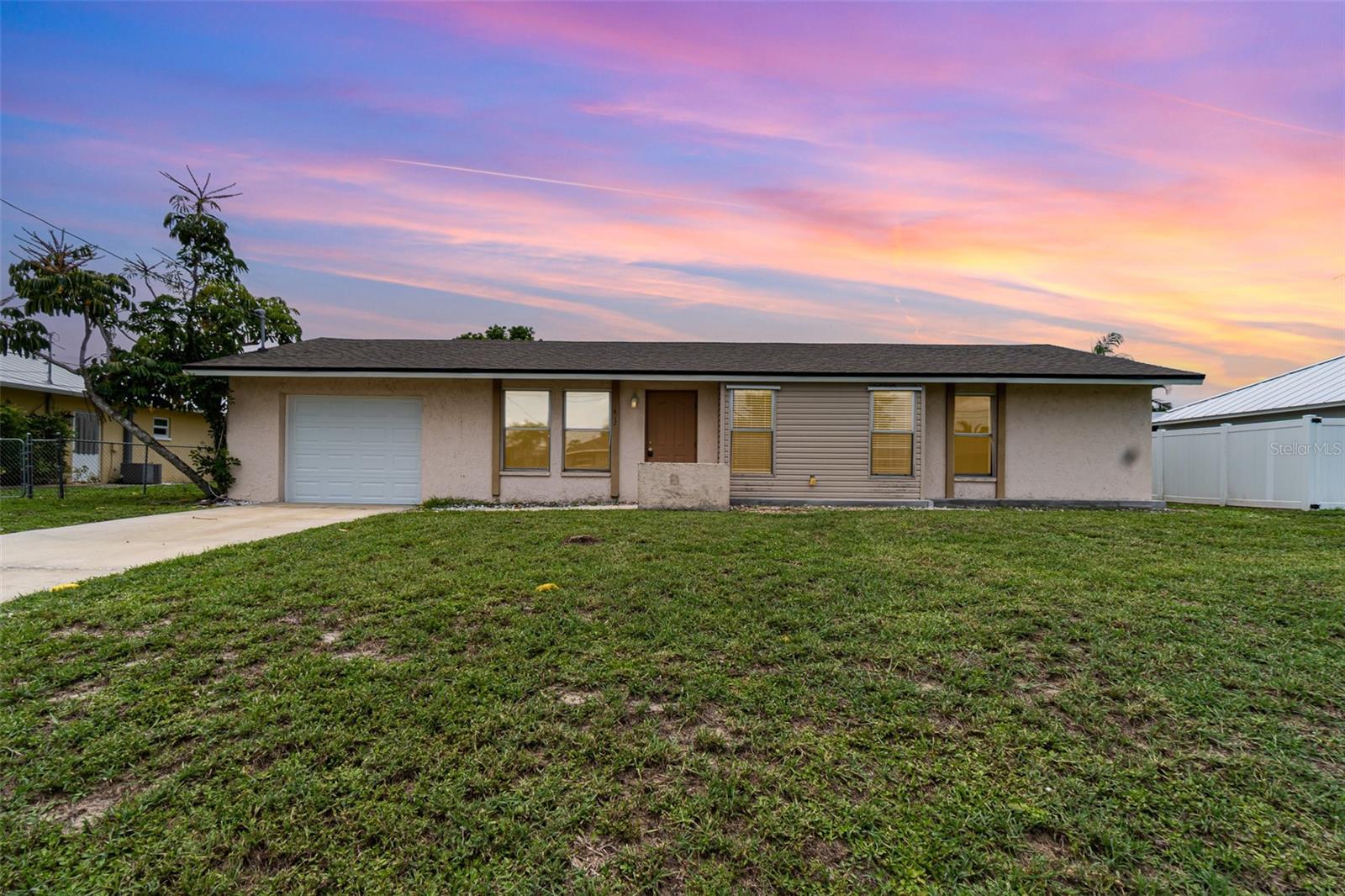 Welcome to your future home or investment gem in sunny Southwest Florida! Endless Potential in the Heart of Cape Coral – Pool Home with Newer Roof, Air Conditioning, Electric panel, and Garage Door. This 3-bedroom, 2-bathroom with living room and extra family room home is full of character, functionality, and opportunity. Located in a quiet, central Cape Coral neighborhood, it features a flexible living space, and a backyard oasis perfect for relaxed living or entertaining. Major Upgrades for Peace of Mind A Roof in (2023), New Garage Door with electric opener (2025) and new A/C (2025) provide lasting value and comfort. This home features a recently installed new electric panel (2024), ensuring modern safety standards, enhanced energy efficiency, and reliable power for all your needs. Newer pool pump (2024). Inside, enjoy luxury vinyl plank flooring (2025) —a sleek, durable upgrade that brings a fresh, modern feel. Your Backyard Paradise Step into your private southern-exposure, fenced backyard with a sparkling inground pool—ideal for lounging, soaking in the sun, or hosting guests. This outdoor haven invites year-round enjoyment. Flexible, Functional Living The open living, dining, and kitchen area flows beautifully, while a separate rear family room offers potential as a 4th bedroom, office, or den. The primary suite includes an en-suite bath and walk-in closet, with generous secondary bedrooms for family or guests. This home requires no flood insurance by lenders! Even better, it’s on city water and sewer with all assessments paid—a huge benefit for Cape Coral homeowners. Prime Location You're close to everything—shopping, dining, parks, beaches, and entertainment. Whether you're into boating, biking, or just relaxing at home, this spot delivers the Florida lifestyle. Customize to Make It Your Own While some cosmetic updates and pool repairs are needed, the home offers strong bones, key mechanical upgrades done, and layout flexibility—perfect for customizing over time or flipping for investment.