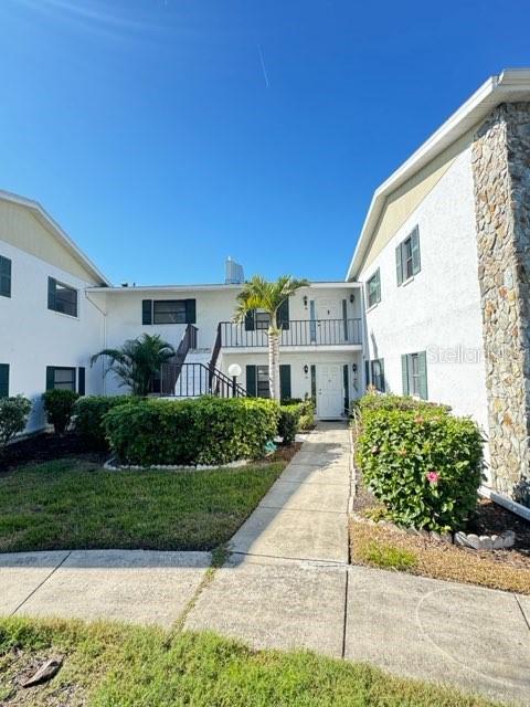 Welcome to this fully furnished and recently updated spacious 2-bedroom, 2-bath condo in the desirable 55+ active community of Morton Village. The open-concept living area features light hardwood floors and flows seamlessly from the living room, with its cozy beige leather sofa set and a glass coffee table, to the adjacent dining area. This inviting space opens onto a spacious Florida room, perfect for relaxing and entertaining. The modern kitchen boasts wood cabinets, stainless steel appliances, a vibrant blue backsplash, elegant countertops, a convenient laundry nook, and stylish lighting. The spacious and well-lit primary bedroom features a king-sized bed and opens directly onto the Florida room, seamlessly blending indoor and outdoor living. The ensuite bathroom offers a spa-like atmosphere with a sleek vanity and mirror, a glass-enclosed bathtub, and stylish wood-look flooring. The guest bedroom, located off the hallway, is spacious and features a comfortable queen bed, a window for ample natural light, and a sleek standing shower. This Bradenton condo offers convenient access to Florida's Gulf Coast lifestyle, including world-renowned beaches like Anna Maria Island and Siesta Key, natural attractions such as Robinson Preserve and De Soto National Memorial Park, and cultural experiences at the Bishop Museum and Village of the Arts. Its proximity to shopping, dining, LECOM Park (Pirates Spring Training), and IMG Academy provides a perfect blend of relaxation and recreation.
NOTE: This community is governed by a homeowners association. Approval may include an application, background screening, fees, and an approval process. Contact the agent for details