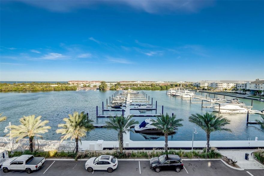 Welcome to the epitome of luxury living at Marina Pointe in the prestigious Westshore Marina District. This completed, move-in-ready home INCLUDING A 40ft BOAT SLIP, boasts stunning water and marina views and presents an unparalleled lifestyle opportunity. With 3 bedrooms plus a bonus room, 4.5 bathrooms, and 2,828 sq feet of meticulously designed space, this residence is a testament to refined elegance. Upon entering, you are greeted by a contemporary open floor plan with soaring 12' ceiling heights on the first floor and 10’ ceilings of floors 2 thru 4, inviting you to experience the seamless fusion of sophistication and comfort. Enjoy seamless access to each level with the convenience of a modern elevator, offering effortless mobility and ensuring ease of movement throughout this stunning property. Floor-to-ceiling glass walls, energy-efficient hurricane-impact resistant windows, and multiple-panel sliding glass doors frame the picturesque views of the water and marina, bringing the beauty of the outdoors inside. The gourmet kitchen is a masterpiece, featuring European-style cabinetry, stainless steel built-in Sub-Zero refrigerator, induction cooktop with stainless steel hood, and premium Wolf microwave and mounted oven. The kitchen is enhanced by an upgrade package that includes a trash can pull-out with (2) bins, a cooktop base cabinet with (2) basket drawers, and (1) cutlery tray for drawers in a wood finish, along with (2) upper cabinet open shelves. The primary bedroom is a sanctuary of luxury, offering a large soaking tub, premium Grohe Eurocube bath fixtures, and designer porcelain tile in the bathroom. Premium flooring, including designer porcelain tile in the kitchen and living areas, elevates the aesthetic throughout the home. Beyond the confines of your unit, Marina Pointe provides a lifestyle of opulence with a 24/7 attended lobby and concierge, virtual indoor golf simulator, fitness center, social lounge, resort-style pool deck, secluded heated spa, day beds, covered pavilion, and gas grills. The property also includes private boat slips in a beautiful deep-water marina, offering direct access to downtown Tampa and downtown St. Petersburg. Marina Pointe, situated on a private peninsula as part of a master-planned community, is not just a residence… it is a lifestyle. A new standard for refined luxury, where world-class amenities meet waterfront splendor, and the best of Tampa and St. Petersburg is just minutes away whether by land or sea.