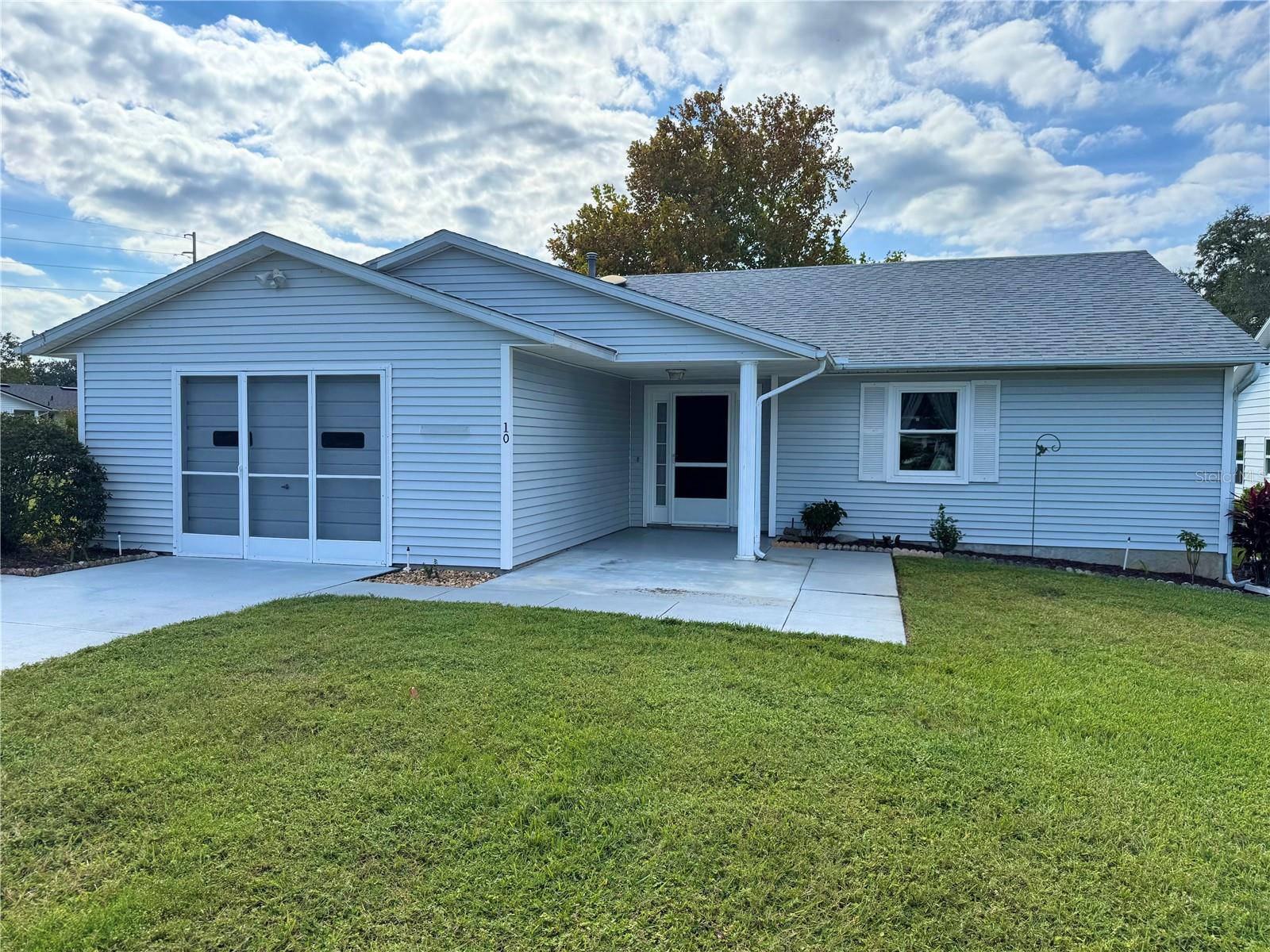 Welcome home!! Ready to make new memories!! This is your opportunity to become a resident of SCOTTISH HIGHLANDS!! A wonderful 55+ community full of natural beauty and friendly neighbors awaits you!! ***NEW WINDOWS 2025!! ***ROOF 2018!! ***TANKLESS WATER HEATER!! ***WELL FOR IRRIGATION!! This warm and cozy home is nestled on a LARGE CORNER LOT with mature landscaping!! The resident clubhouse, recreation center, gym, and both pools (indoor is heated) are conveniently located one block from your front door!! A long driveway leads you to the covered front porch. This 2 bed/2 bath home boasts 1336 sq. ft. under AC and has a warm Living/Dining area. There is a partial vaulted ceiling in the living room as well. The quaint kitchen has ample natural light, newer appliances, and plenty of cabinets!! The generous Primary Ensuite includes an L-shaped vanity and walk-in shower stall. Nearby is the guest bed/bath. There is a very spacious garage with an additional side entry, also screened, with WASHER/DRYER + room enough for a small WORKSHOP!! The HOA fee includes basic cable and Internet!! ***Conveniently being sold with all furnishings*** Close to Publix, restaurants, Worship, and the Leesburg Mall. Plus, Disney is about an hour drive!! Make this your new address!!