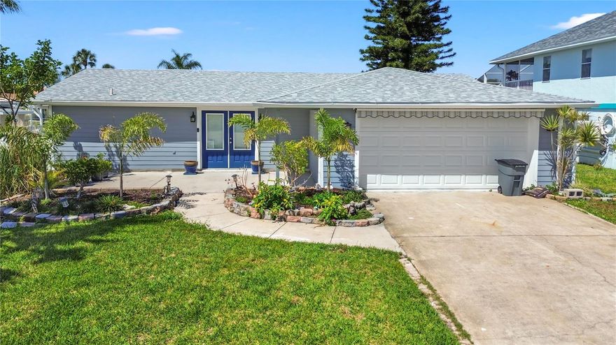 PRICE IMPROVEMENT! This very desired newly renovated split ranch 2 bedroom, 2 bath open floor plan home is situated on a deep-water canal with direct access to the vast Gulf of Mexico, ideal for kayaking and watercraft adventures. Ceramic tile throughout the home gives a very polished look and feel. For those seeking urban adventures, Tampa is just an hour's drive away, offering professional sporting events, beaches, and tourist attractions. The Primary Suite has its own bath & walk in closet. The laundry closet is conveniently located in the additional walk in closet. Primary Bath has been updated and leads out to the pool. Brand new AC unit, water heater, washer, dryer, and refrigerator all convey with property. Three separate outdoor seating areas makes for a beautiful entertaining space. Tons of great features included updated hurricane rated windows and updated doors. Electrical panel replaced 2020, full roof replaced in 2022. Floating doc was replaced in 2021. Downtown New Port Richey is just a short drive away and is lively and quaint with many restaurants, bars, shops, and Sims Park where you can enjoy one of the many special events and outdoor concerts throughout the year or stroll along the beautiful Riverwalk along the Cottee River. *Flood insurance policy is transferrable*