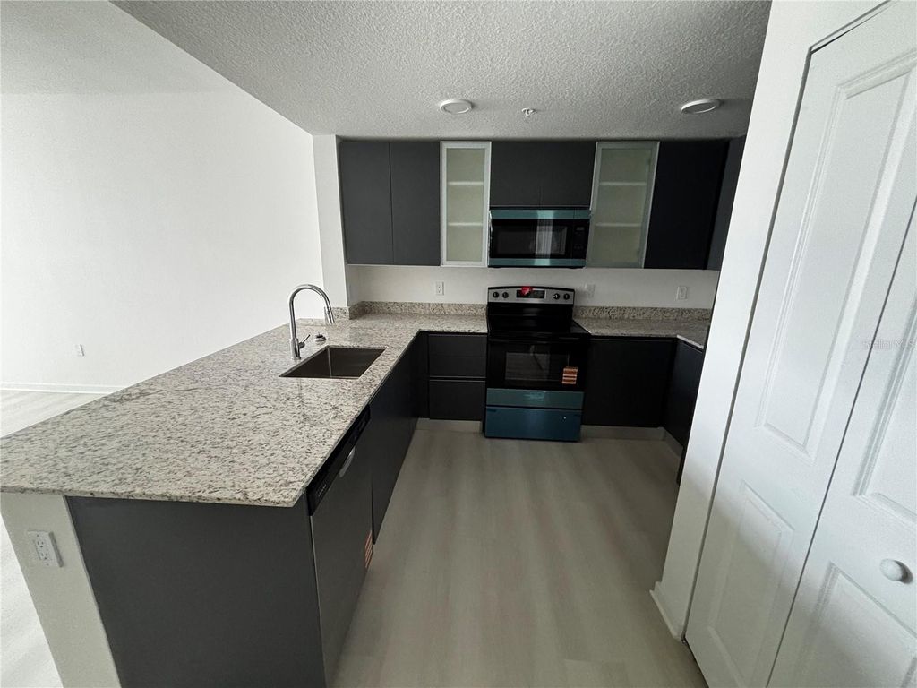 Photo of 5563 Millenia Park Boulevard #411, Orlando, FL 32839 (MLS # O6427471)