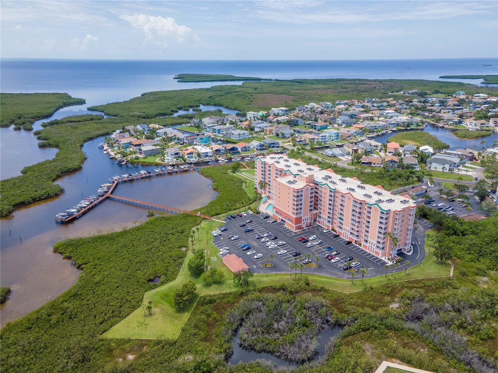 STUNNING PENTHOUSE 3 BED / 2 BATH / 1,500 sq ft CONDO WITH STORAGE AND BEACH ACCESS AT HIGHLY SOUGHT SEAVIEW PLACE OF NEW PORT RICHEY! This condo has it all including a VIEW OF THE COASTLINE AND GULF from the 9th floor! The spacious kitchen boasts Granite countertops, Stainless Steel appliances, upgraded wood cabinets, pantry, and breakfast bar! The Primary Bed/Bathroom features a walk-in closet, dual vanity topped w/ Granite, Garden Jacuzzi tub, Walk-In shower, Gulf Views, and Balcony access! You will find two more bedrooms, all with Walk-In Closets, and another upgraded bathroom on the other side of the condo. Other great features of this condo include spacious living room with water views, formal dining room, newer kitchen appliances, newer carpet in bedrooms, new paint, new toilets, and hurricane-rated windows and doors! This condo also includes a reserved parking spot #19 in addition to guest parking and additional open parking spaces, separate climate controlled storage unit, and boat slip #27, the largest boat slip available. Your monthly condo fee of $900 a month covers and includes: CABLE TV, COMMUNITY POOL & SPA, PIER, DOCK AND BOAT SLIP, CLUBHOUSE, FITNESS CENTER, SOCIAL CLUB ACTIVITIES, MAINTENANCE EXTERIOR, LANDSCAPING, PEST CONTROL, WATER, TRASH, AND SEWER making it a perfect choice for those seeking luxury and convenience! Residents also have the option to purchase private beach access for a small yearly fee to Gulf Harbors Beach club! Set up your showing fast, this one will not last!