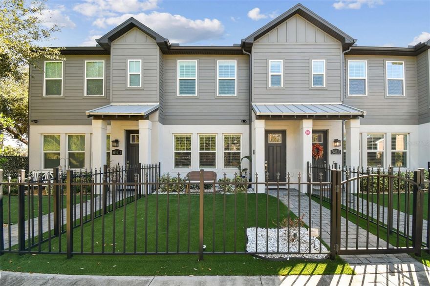 Built in 2021 and offered by its original owners, this thoughtfully designed townhome delivers the scale and livability of a single-family residence with the ease of low-maintenance living. A charming streetscape sets the tone, with each of the four residences featuring its own fenced front yard and a private sidewalk leading to the front door, an uncommon and welcoming touch for townhome living. Spanning over 2,300 square feet, the open-concept main level is anchored by hardwood floors, a generous family room, and a polished kitchen featuring quartz countertops, stainless steel appliances, solid wood cabinetry, a walk in pantry with wine fridge and counterspace, and an oversized island ideal for both everyday living and entertaining. A powder bath, mudroom, and attached two-car garage complete the first floor, while a rear garage court creates a welcoming and private guest entry. Upstairs, all three bedrooms are well-proportioned, including a spacious primary suite with two walk-in closets and a refined bath highlighted by a marble double vanity. Each secondary bedroom offers its own double door built-in closet and shares a hall bath while the upstairs laundry adds thoughtful convenience. Located in the heart of South Tampa, a lock-and-leave lifestyle is paired with close proximity to dining, shopping, and everyday essentials, making daily life effortless and well connected.