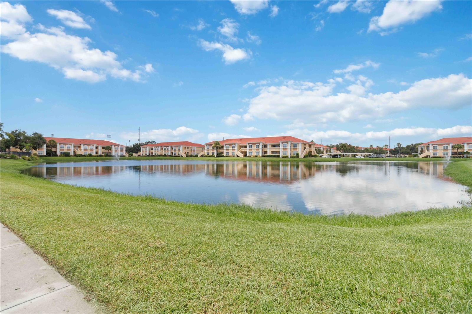 Location, Location, Location!! This fully updated 2/2 corner unit, close to downtown Sarasota, impresses with expansive water views and a prime location right next to all the community amenities. You'll love the unit’s bright, open feel as soon as you enter the living / dining room area with crown moldings. Glass sliding doors lead out to your covered lanai allowing even more light into this already stunning unit. Enjoy a cup of coffee while gazing at the beautiful lake views and watching Florida's wildlife. The well-appointed kitchen boasts ample custom cabinetry and a breakfast bar. Whether you're preparing a delicious meal or hosting a gathering, this open floor concept is designed to meet your everyday needs. This spacious condominium has new luxury vinyl plank flooring throughout the home and was freshly painted. The primary bedroom features a large walk-in closet and en-suite bathroom with a gorgeously tiled high end walk-in shower. The second bedroom is located on the other side of the unit, providing privacy and plenty of closet space. The second bathroom with bathtub is also fully updated and is located right next to the second bedroom. Enjoy the convenience of your in-house washer and dryer. An additional storage/office nook helps you keep everything organized. The unit is nestled within the gated Villagio condominium association, minutes away from downtown Sarasota, shopping and the beautiful beaches, with easy access to 301, I75 and public transportation. Community amenities include a heated resort-style pool, tennis court, playground and gym. Rent is $2100 (no utilities included) and move in requirements are first month's rent and a security deposit equal to one month’s rent. The Villagio charges $100.- per adult for the background check. Unfortunately, pets are not allowed, and it is a nonsmoking unit. Please call today to set up your private tour in person or virtual tour.