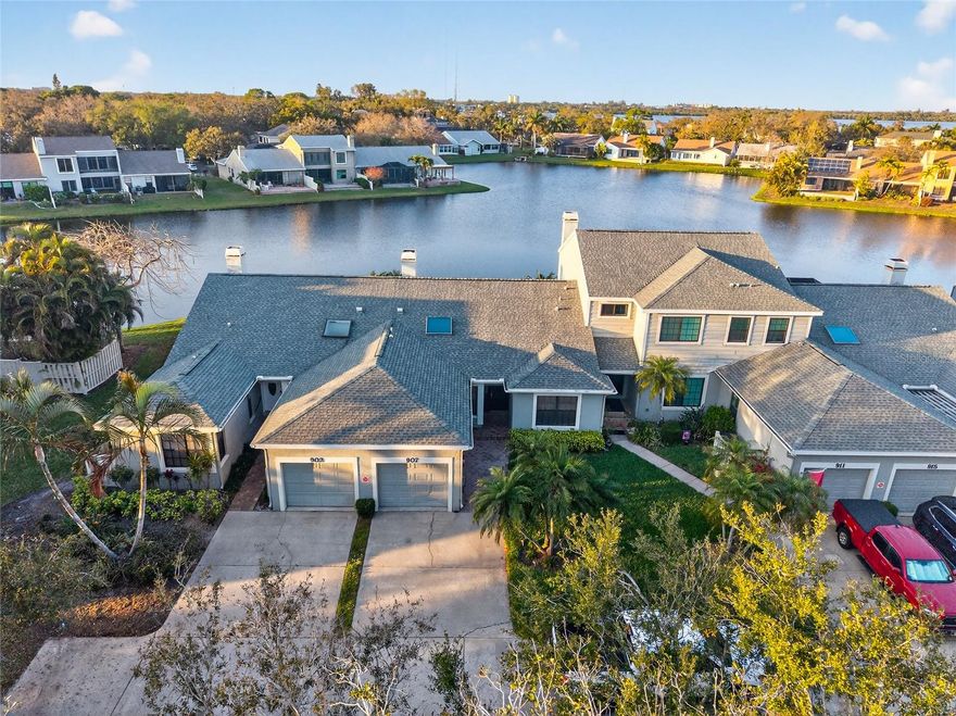 Wake up to WATER VIEWS. Come home to GATED peace of mind. Live the St. Pete lifestyle.
Tucked inside the highly sought-after community of Caya Costa in Northeast St. Petersburg, this CONCRETE BLOCK lakefront villa offers the rare combination of privacy, lifestyle, and location that today’s buyers are searching for.
Step into a bright, private foyer that immediately feels welcoming and tucked away from the world. To your left, the eat-in kitchen features NEW LUXURY VINYL FLOORING and a sunny space for morning coffee, along with convenient access to the laundry area and steps down to the garage. The layout is practical, comfortable, and designed for everyday living.
Continue straight into the spacious great room, anchored by a WOOD-BURNING FIREPLACE and framed by expansive sliding glass doors showcasing TRANQUIL LAKE VIEWS. Natural light fills the space, creating an inviting setting for relaxing evenings or effortless entertaining.
To the right of the foyer sits the secondary bedroom and full bath, thoughtfully positioned for guests or flexible use as a home office. Toward the back of the home, the primary suite serves as a quiet retreat, complete with a WELL-DESIGNED LAYOUT featuring a separate vanity area, walk-in closet, and private tub and toilet space. Sliding doors open directly to the SCREENED-IN PATIO, where peaceful mornings and breezy evenings overlooking the water become part of your daily routine.
Caya Costa delivers TRUE LOW-MAINTENANCE LIVING with a community pool, hot tub, tennis courts, pickleball courts, private boat ramp, gazebo, optional boat storage, and secure gated entry. Lawn care and exterior maintenance are handled so you can spend more time enjoying the Florida lifestyle.
Just minutes from DOWNTOWN ST. PETERSBURG, waterfront parks, marinas, Beach Drive dining, and award-winning Gulf beaches, this home offers the best of both serenity and connection.
Lakefront serenity. Gated privacy. The St. Pete lifestyle.