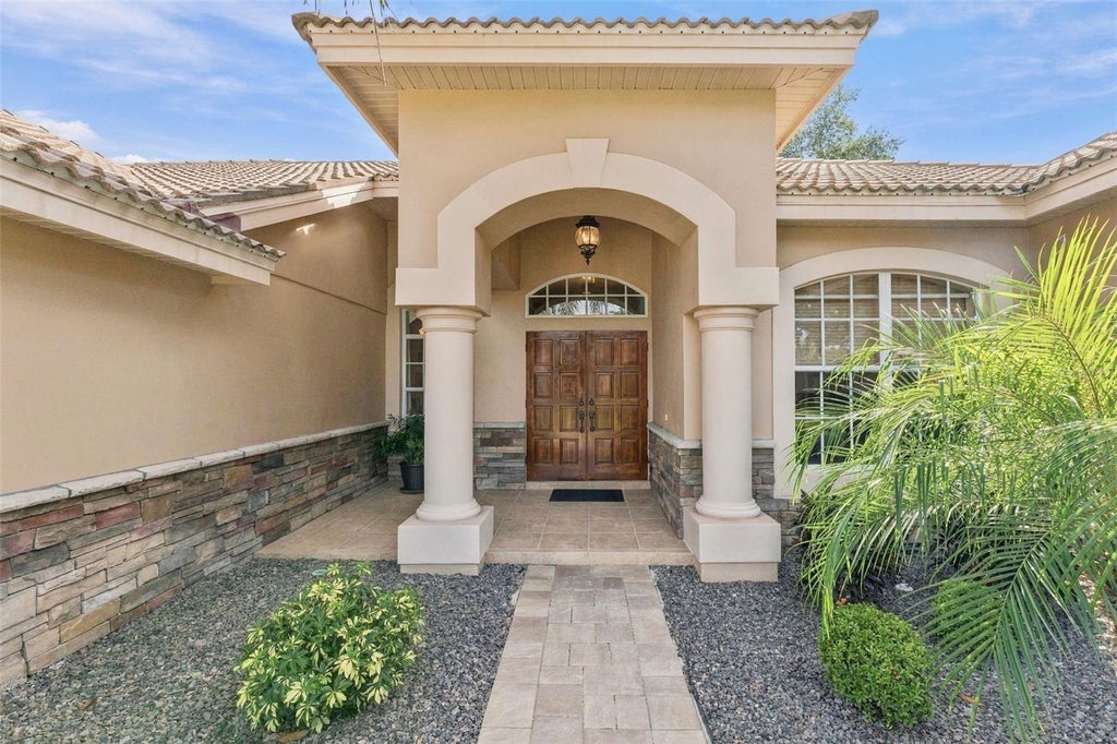 Photo of 1663 Canopy Oaks Boulevard, Palm Harbor, FL 34683 (MLS # TB8560499)