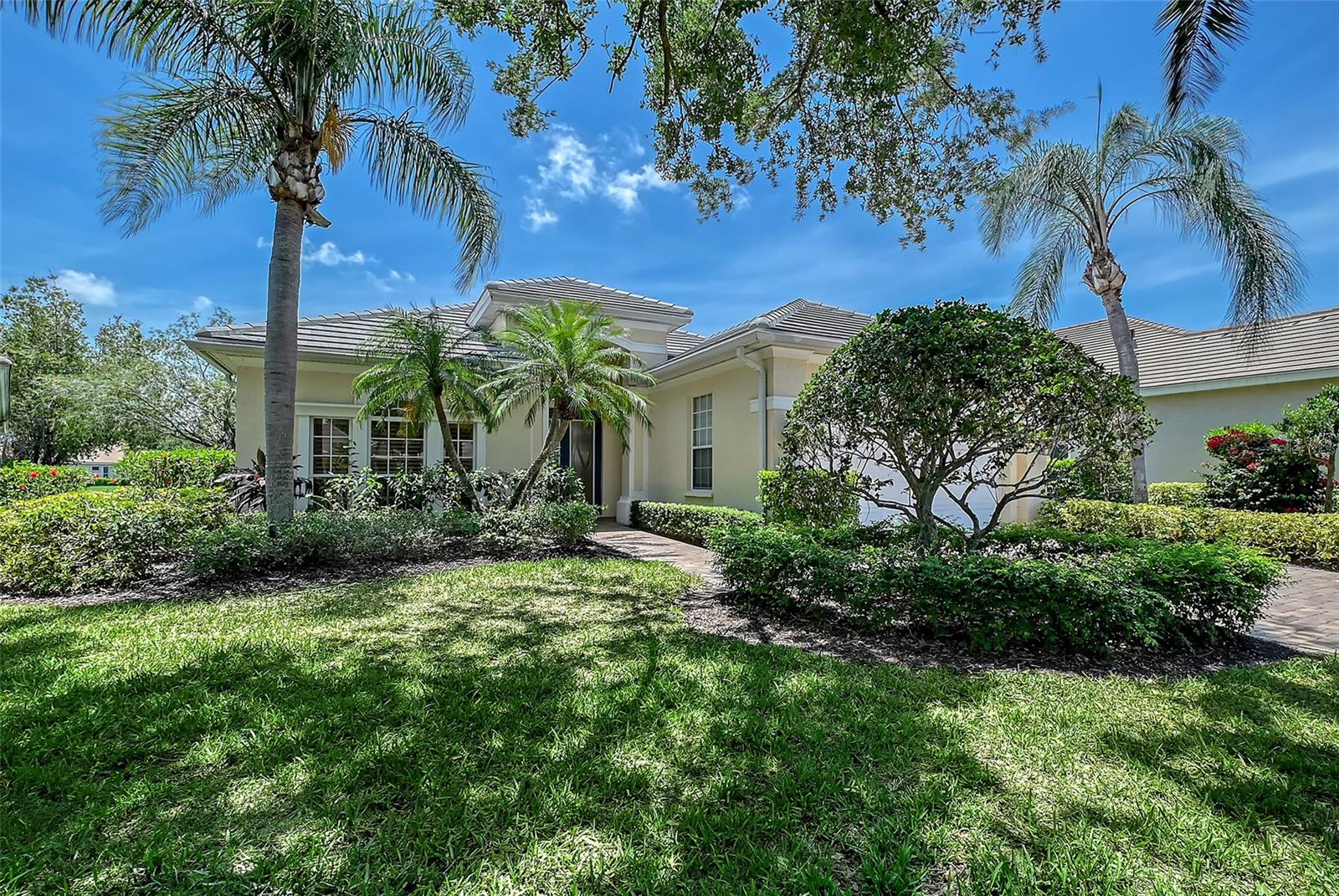 Welcome to this beautifully maintained 2-bedroom, 2-bath home with a spacious den, located in the desirable, landscape-maintained neighborhood of Ascot in the award-winning University Park Country Club. With a NEW ROOF installed in May 2025, this home blends comfort, style, and peace of mind. Throughout the home, you'll find a combination of neutral tile and engineered hardwood flooring, offering both durability and low-maintenance living.
As you approach, a brick-pavered driveway and walkway lead you to an inviting glass double front door with a transom window, framed by lush, mature landscaping that enhances the home’s curb appeal.
Step inside to a bright and inviting foyer with high tray ceilings. Just off the foyer, French doors open to a versatile den/office featuring Bermuda shutters, accent windows, and a ceiling fan—perfect for working from home or relaxing with a good book.
To the right, the guest wing offers a generously sized bedroom, as well as a full bathroom with a tub/shower combination and quartz countertops. Nearby, a well-appointed laundry room includes washer and dryer, a utility sink, built-in ironing board, large utility closet, and access to the 2-car garage with painted floors.
The open-concept living area is perfect for entertaining, with a spacious dining room featuring tray ceilings flows seamlessly into the light and airy kitchen. The kitchen is a chef’s dream, offering BRAND NEW STAINLESS-STEEL APPLIANCES, quartz countertops, a breakfast bar, pantry closet, recessed lighting, and a sunny eat-in area with access to the lanai.
The family room, open to the kitchen, has triple sliding doors with a transom window that lead to your private outdoor oasis.
The primary suite is a tranquil retreat with a cozy seating area, accent window, and private access to the lanai. The large ensuite bath includes dual vanities with quartz countertops, a zero-entry walk-in shower, and a spacious walk-in closet complete with a custom closet system.
Step outside to enjoy the Florida lifestyle on your screened lanai with brick pavers surrounding the sparkling pool and take in serene views of the pond beyond. This home is also available furnished, making it truly move-in ready.
Don't miss your opportunity to live in one of the area's most sought-after communities, known for its championship golf, tennis, and vibrant social lifestyle.
University Park Country Club is consistently ranked one of the top courses in Florida featuring 27 holes of championship golf; tennis and pickleball; fitness center, croquet – as well as an array of social and group activities. Just a 15-minute drive outside this peaceful enclave is downtown Sarasota, with shopping, arts & theatres, museums, dining and entertainment, top-ranked healthcare, beaches and SRQ International Airport. Two miles east of UPCC is the convenience of I-75, University Town Center with 300 nationally known and homegrown shops, restaurants, fitness studios, services and attractions and the Nate Benderson Park, home of world-class rowing events.
Enjoy the club amenities with the required minimum of a Social membership at UPCC, which is owned by the residents through a Recreation District.
