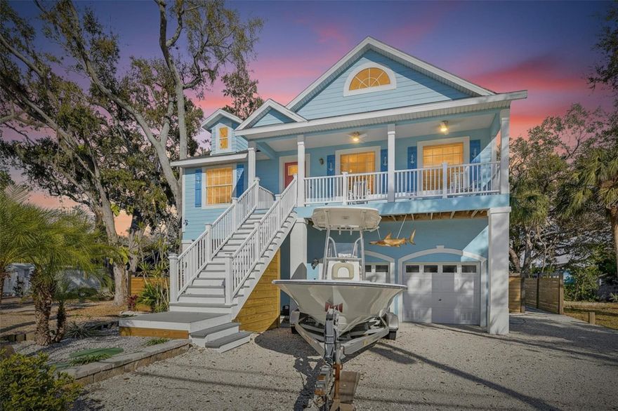 1116 Canal St | 4 Bedrooms | 3 Bathrooms | 1,545 Sq Ft | Canal Front | No HOA

Canal-front living with no HOA in this fully remodeled 4-bedroom, 3-bath, 2-car garage home located in a quiet Ruskin neighborhood. This property offers direct canal access, a private dock, and a separate in-law suite, making it ideal for multi-generational living, guests, or rental flexibility. Recent upgrades include a brand new roof, brand new air conditioning system, new water heater, new whole-home water filtration system, and fresh interior and exterior paint.

The main living level features luxury vinyl flooring, vaulted ceilings, wainscoting, plant ledges, and French doors, all finished in modern coastal-inspired colors and design. The kitchen includes white cabinetry, granite countertops, pendant lighting over the island with breakfast bar, stainless steel appliances, French door refrigerator, tile backsplash, recessed lighting, and a window overlooking the canal.

The primary suite offers dual closets and a well-appointed bath with a jetted garden tub, separate shower with decorative niche and glass doors, split custom cabinet vanities, framed mirrors, and shiplap accents that continue the coastal feel of the home.

The downstairs in-law suite functions as a studio apartment and includes a ceiling fan, crown molding, kitchenette with stainless steel refrigerator and microwave, granite counters, recessed lighting, a full bath with shower, quartz vanity with framed mirror, and a private washer and dryer.

Outdoor living is a standout feature with bay views from the front patio and a backyard designed for waterfront enjoyment. The yard is finished with crushed shell and includes a 10x10 gazebo, firepit, a 6-boat kayak rack, kayak/canoe launch, and a private dock on a quiet canal. The dock features solar-powered lighting, and the covered rear patios on two levels include ceiling fans and outdoor lighting. Paver walkways with glued gravel connect the outdoor spaces, and mature trees provide privacy. There is also an outdoor shower and abundant storage space under both the front and rear patio stairs.

Additional practical features include major mechanical systems thoughtfully elevated above ground level for added peace of mind.

Conveniently located off US Highway 41 with easy access to St. Petersburg, Bradenton, Sarasota, Tampa, major sporting and concert venues, and world-class Gulf beaches, this canal-front home offers a rare combination of location, updates, and waterfront lifestyle.