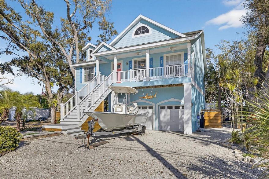 1116 Canal St | 4 Bedrooms | 3 Bathrooms | 1,545 Sq Ft | Canal Front | No HOA

Canal-front living with no HOA in this fully remodeled 4-bedroom, 3-bath, 2-car garage home located in a quiet Ruskin neighborhood. This property offers direct canal access, a private dock, and a separate in-law suite, making it ideal for multi-generational living, guests, or rental flexibility. Recent upgrades include a brand new roof, brand new air conditioning system, new water heater, new whole-home water filtration system, and fresh interior and exterior paint.

The main living level features luxury vinyl flooring, vaulted ceilings, wainscoting, plant ledges, and French doors, all finished in modern coastal-inspired colors and design. The kitchen includes white cabinetry, granite countertops, pendant lighting over the island with breakfast bar, stainless steel appliances, French door refrigerator, tile backsplash, recessed lighting, and a window overlooking the canal.

The primary suite offers dual closets and a well-appointed bath with a jetted garden tub, separate shower with decorative niche and glass doors, split custom cabinet vanities, framed mirrors, and shiplap accents that continue the coastal feel of the home.

The downstairs in-law suite functions as a studio apartment and includes a ceiling fan, crown molding, kitchenette with stainless steel refrigerator and microwave, granite counters, recessed lighting, a full bath with shower, quartz vanity with framed mirror, and a private washer and dryer.

Outdoor living is a standout feature with bay views from the front patio and a backyard designed for waterfront enjoyment. The yard is finished with crushed shell and includes a 10x10 gazebo, firepit, a 6-boat kayak rack, kayak/canoe launch, and a private dock on a quiet canal. The dock features solar-powered lighting, and the covered rear patios on two levels include ceiling fans and outdoor lighting. Paver walkways with glued gravel connect the outdoor spaces, and mature trees provide privacy. There is also an outdoor shower and abundant storage space under both the front and rear patio stairs.

Additional practical features include major mechanical systems thoughtfully elevated above ground level for added peace of mind.

Conveniently located off US Highway 41 with easy access to St. Petersburg, Bradenton, Sarasota, Tampa, major sporting and concert venues, and world-class Gulf beaches, this canal-front home offers a rare combination of location, updates, and waterfront lifestyle.