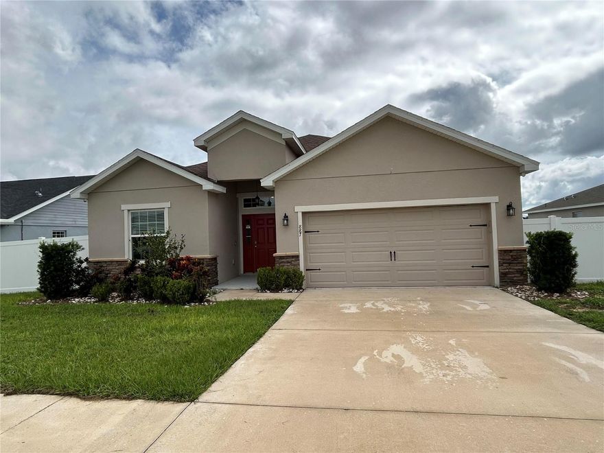 Fully fenced yard and huge covered lanai! This beautiful 2032 square foot home features 4 bedrooms, 2.5 bathrooms, and an open living area. Located in a quiet neighborhood close to theme parks, dining, shopping and major highways. Enjoy an open kitchen with expresso cabinets, Samsung stainless steel appliances, extra large pantry, HUGE counter height island, fully open to the dining and gathering room. No carpet! All plank, vinyl flooring throughout! Washer and Dryer included! Most pets welcome and Free applications always!