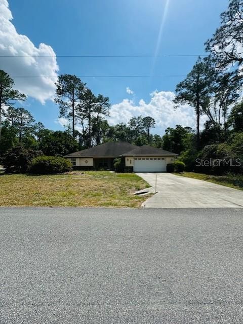 Photo of 800 Virginis Dr, Citrus Springs, FL 34434 (MLS # TB8377368)